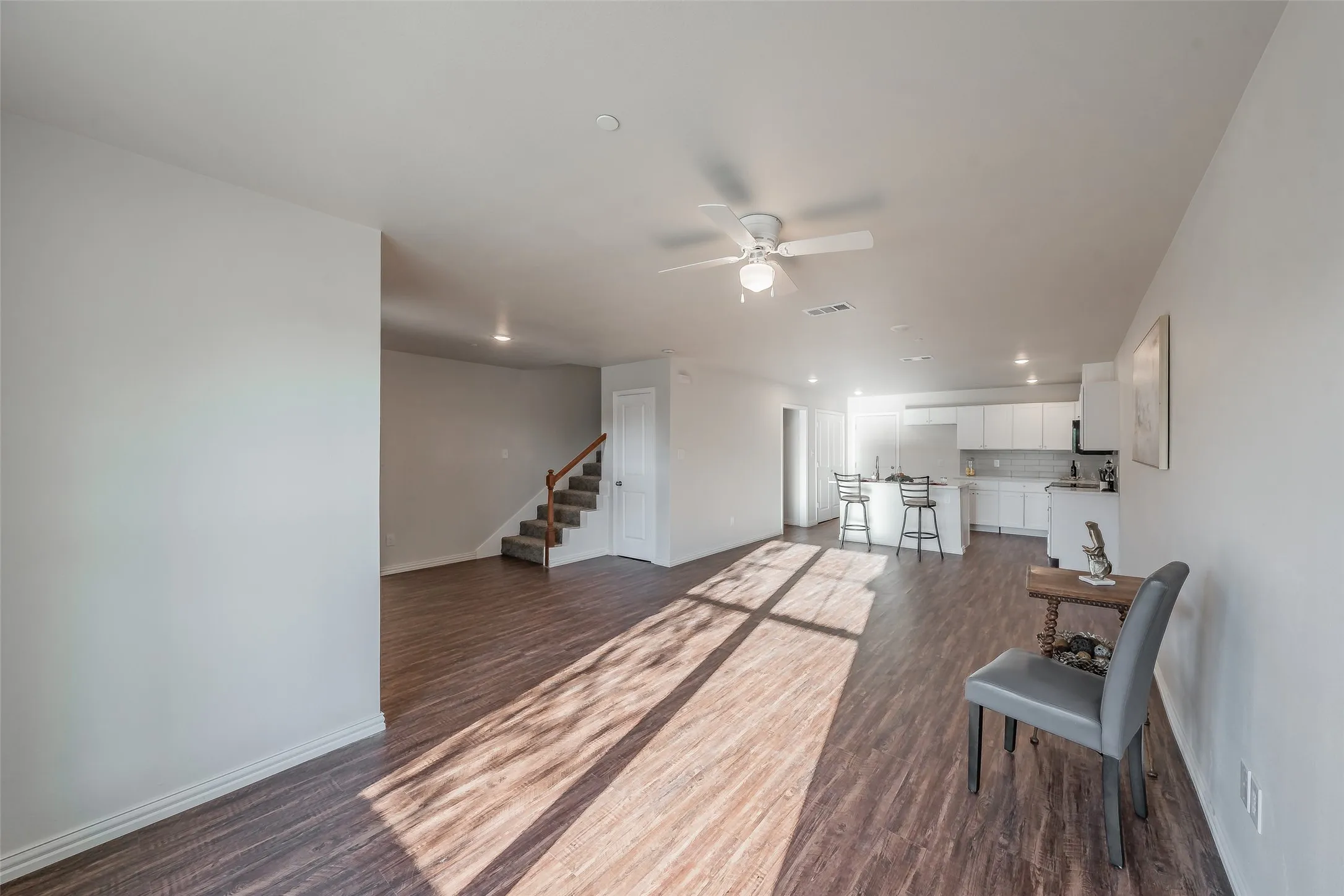Open concept floor plan , keep all engaged. Stairway lead to all bedrooms and utility area.