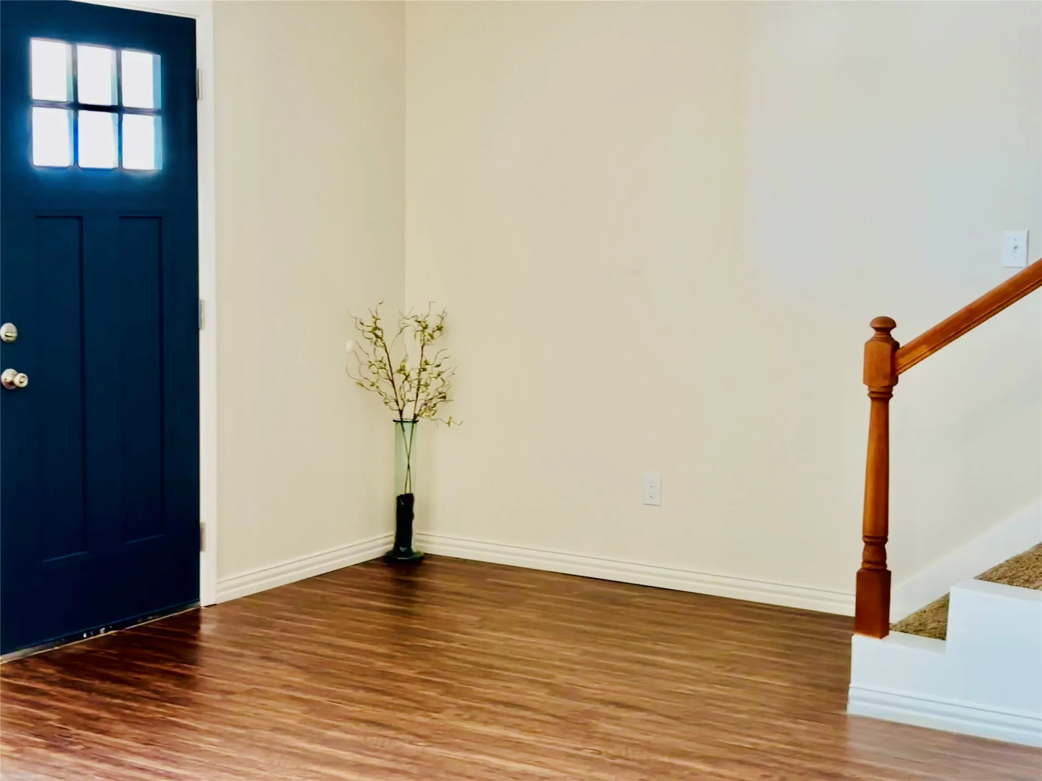 Entryway with luxury plank vinyl hardwood / wood-style flooring . Wonderful spot to decorate the entryway .