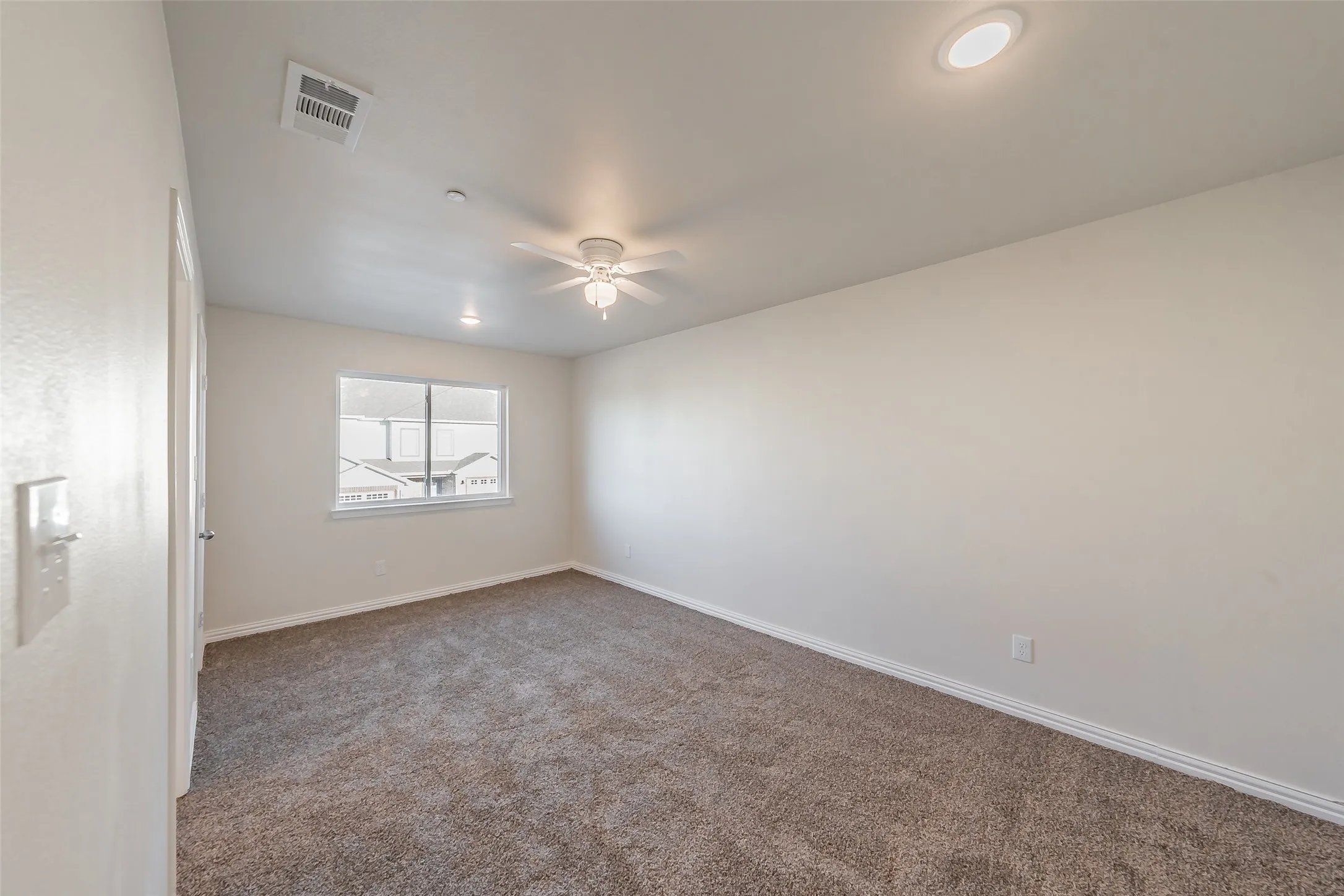 Plush carpet and ceiling in the master bedroom, blind has been installed