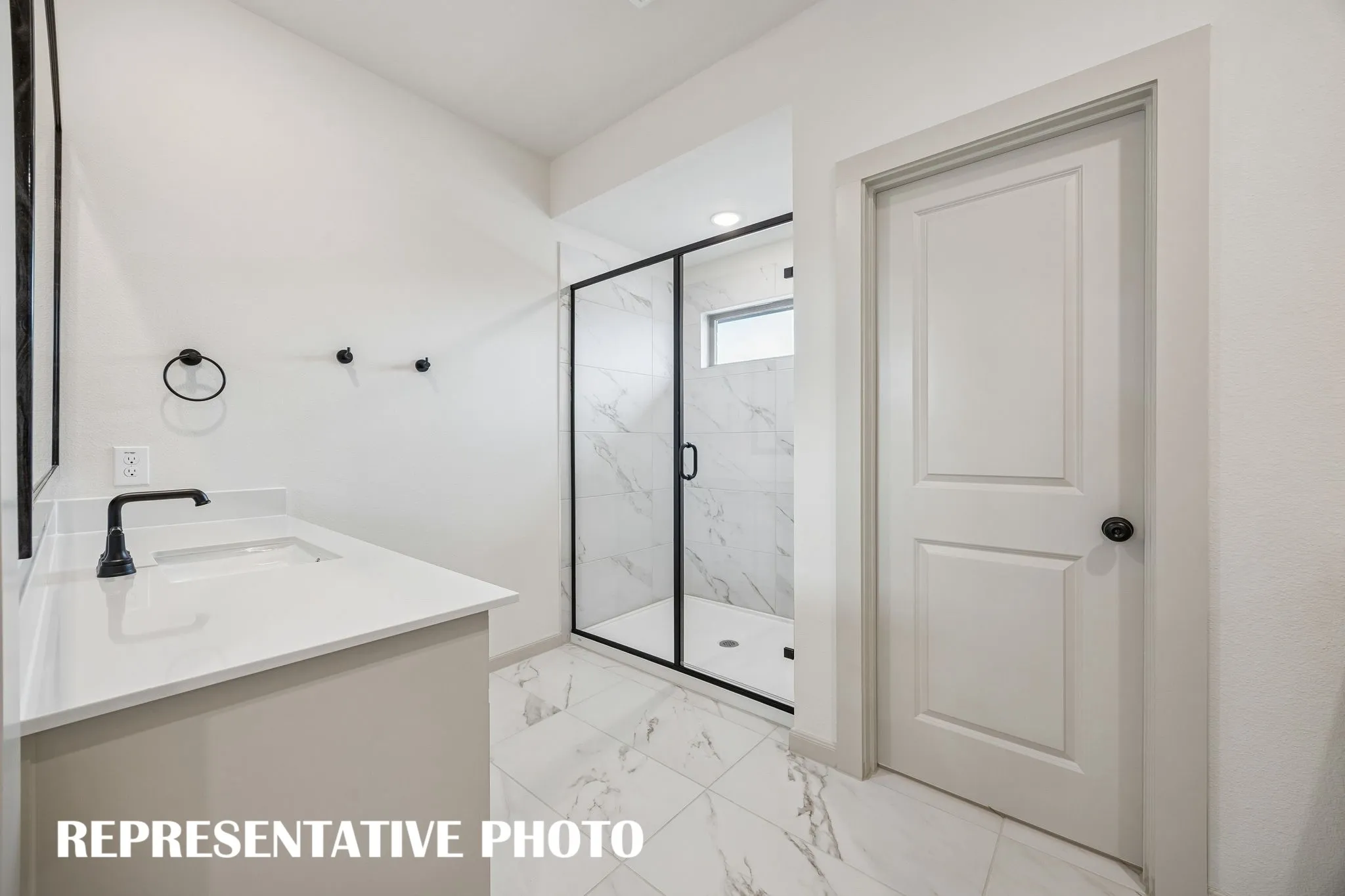 You'll enjoy the oversized walk in shower in this owner's bath.  REPRESENTATIVE PHOTO