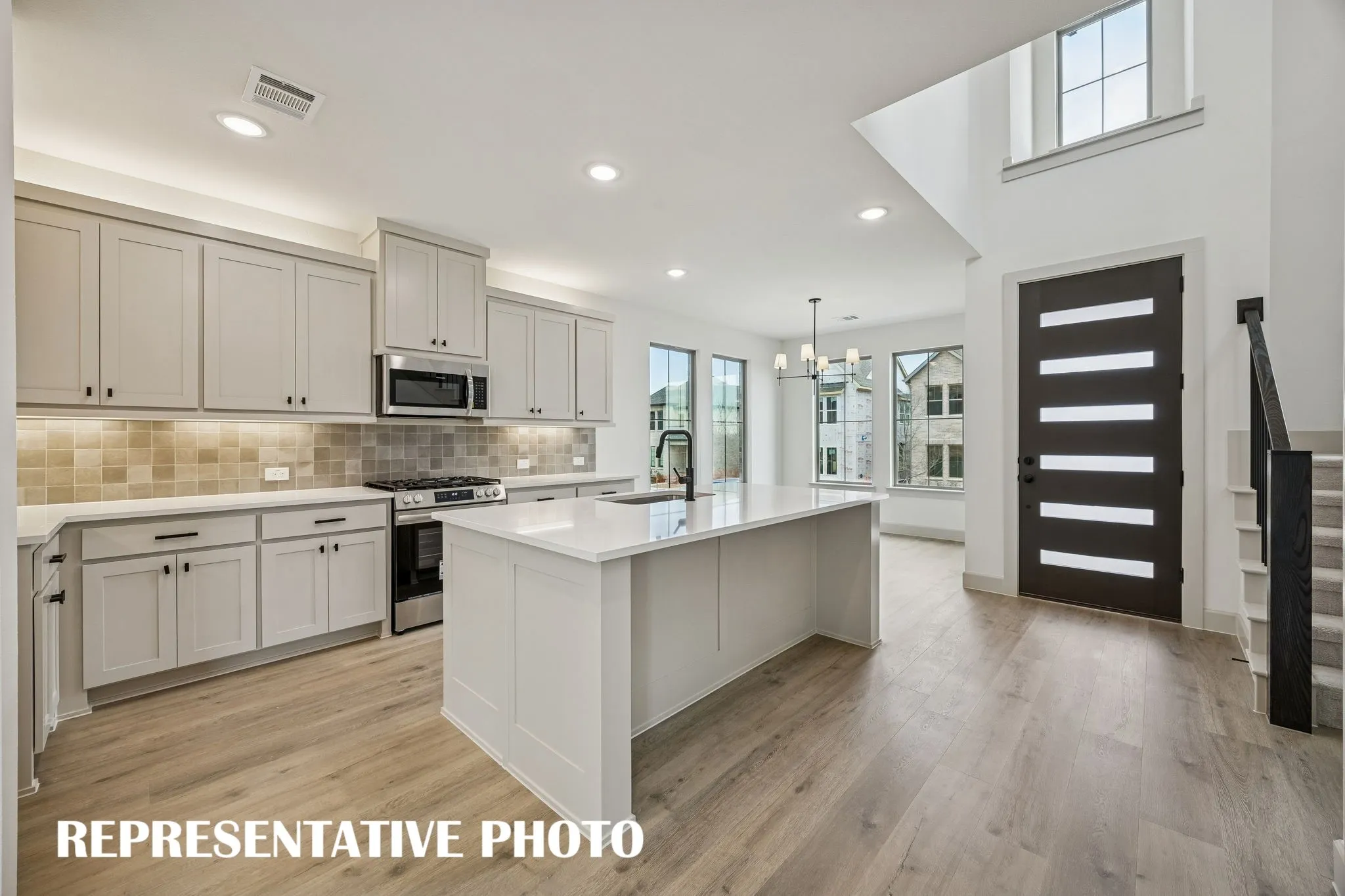 Open and light filled, this dream kitchen is the perfect place to host family and friends.  REPRESENTATIVE PHOTO