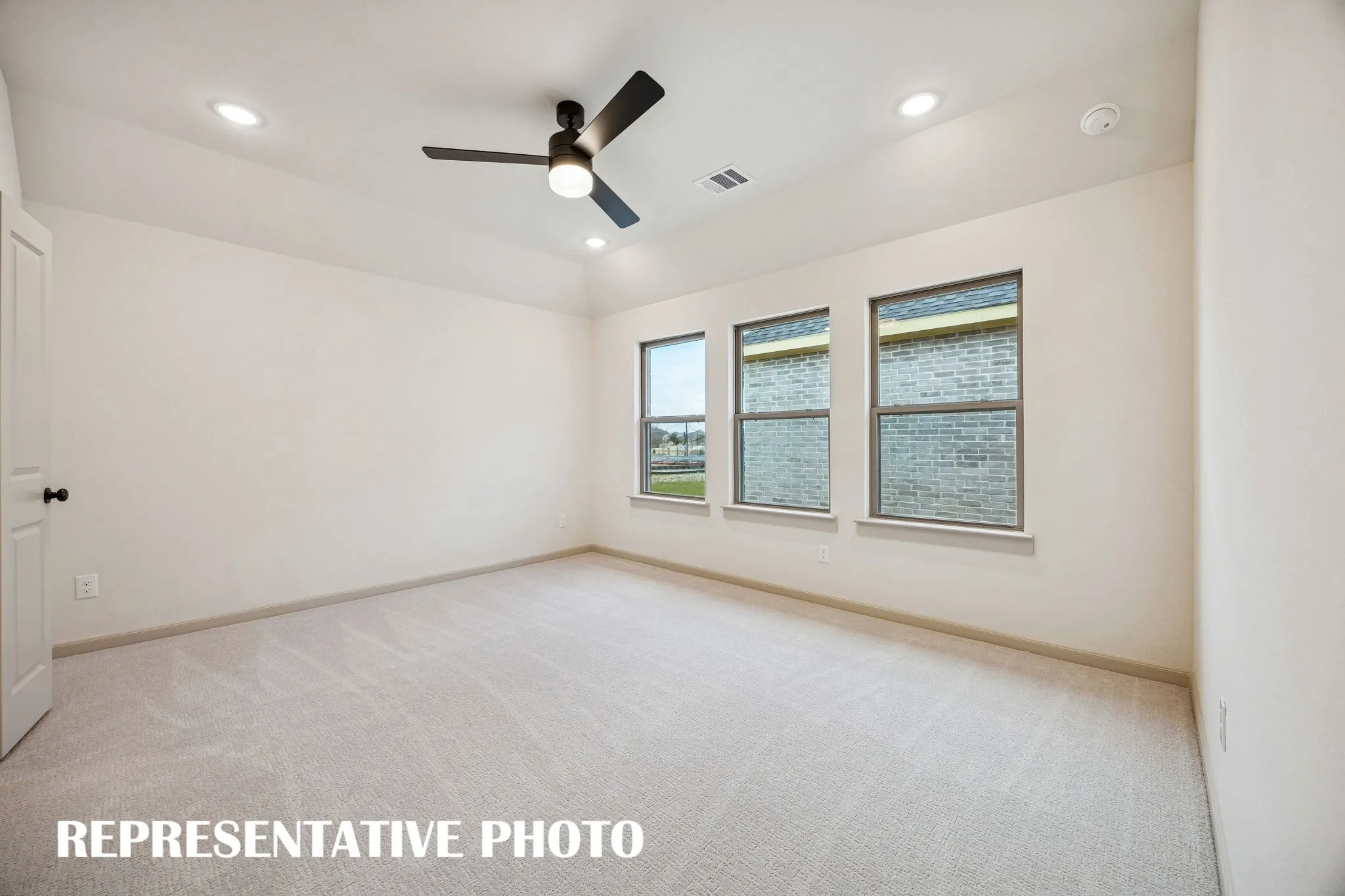 With high ceilings, plush carpeting and a wall of windows, this owner's suit is the perfect place for rest and relaxation.  REPRESENTATIVE PHOTO