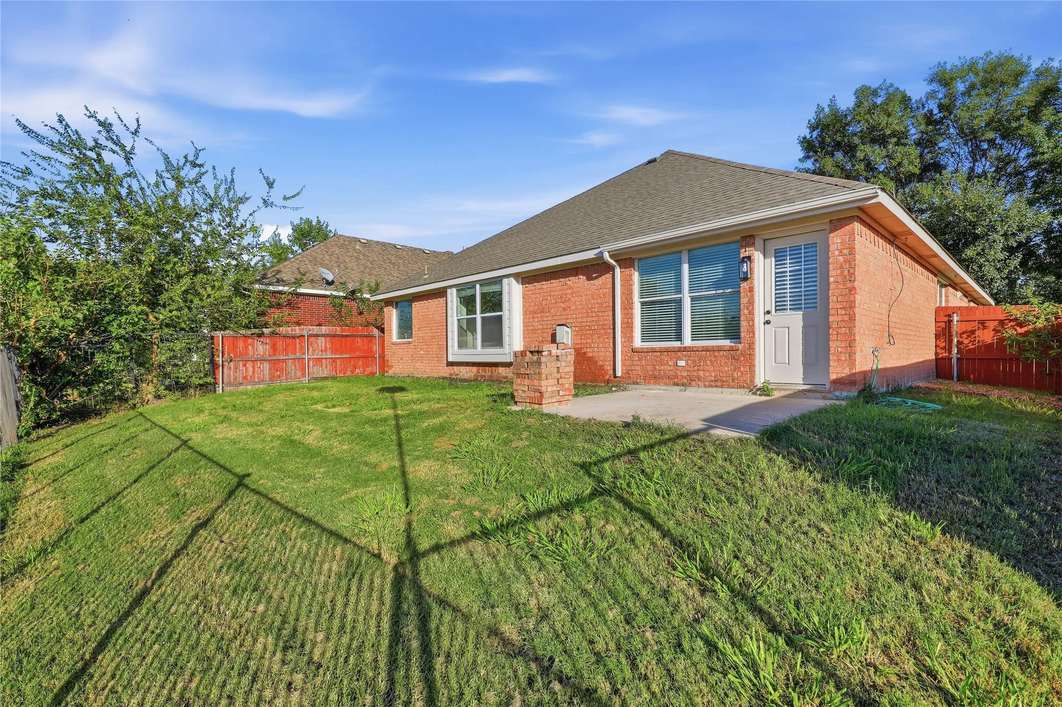 Brick exterior with a gabled roof and white trim