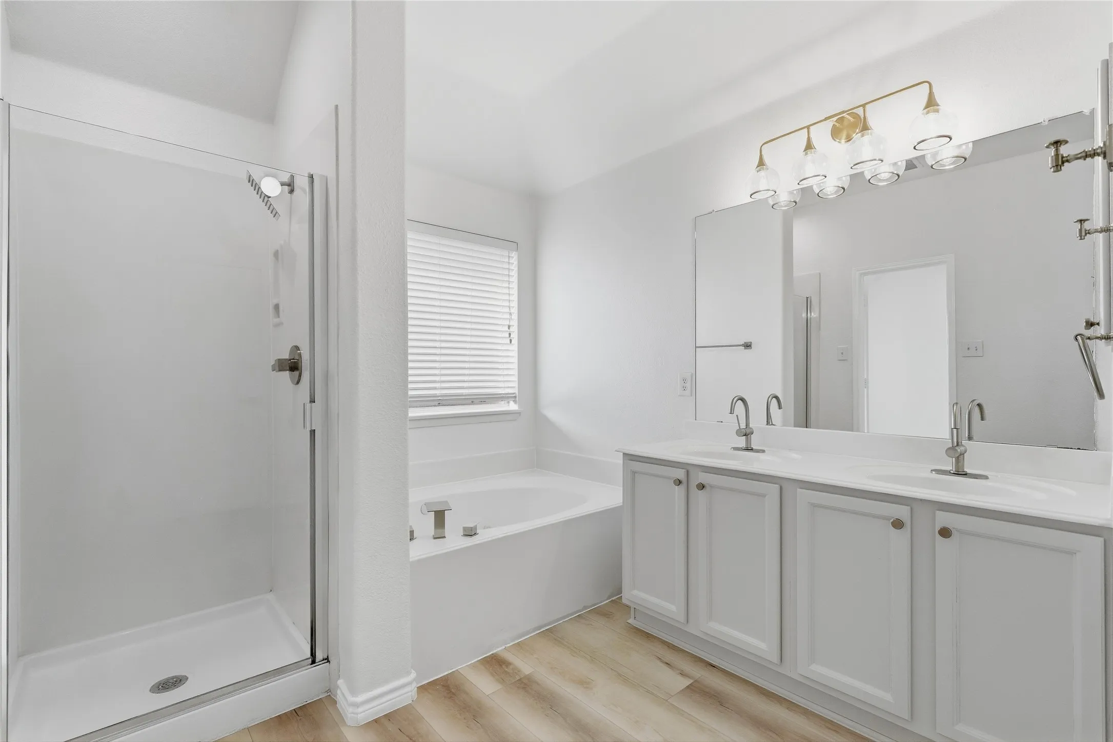 Dual vanity with undermount sinks and light-finish cabinetry