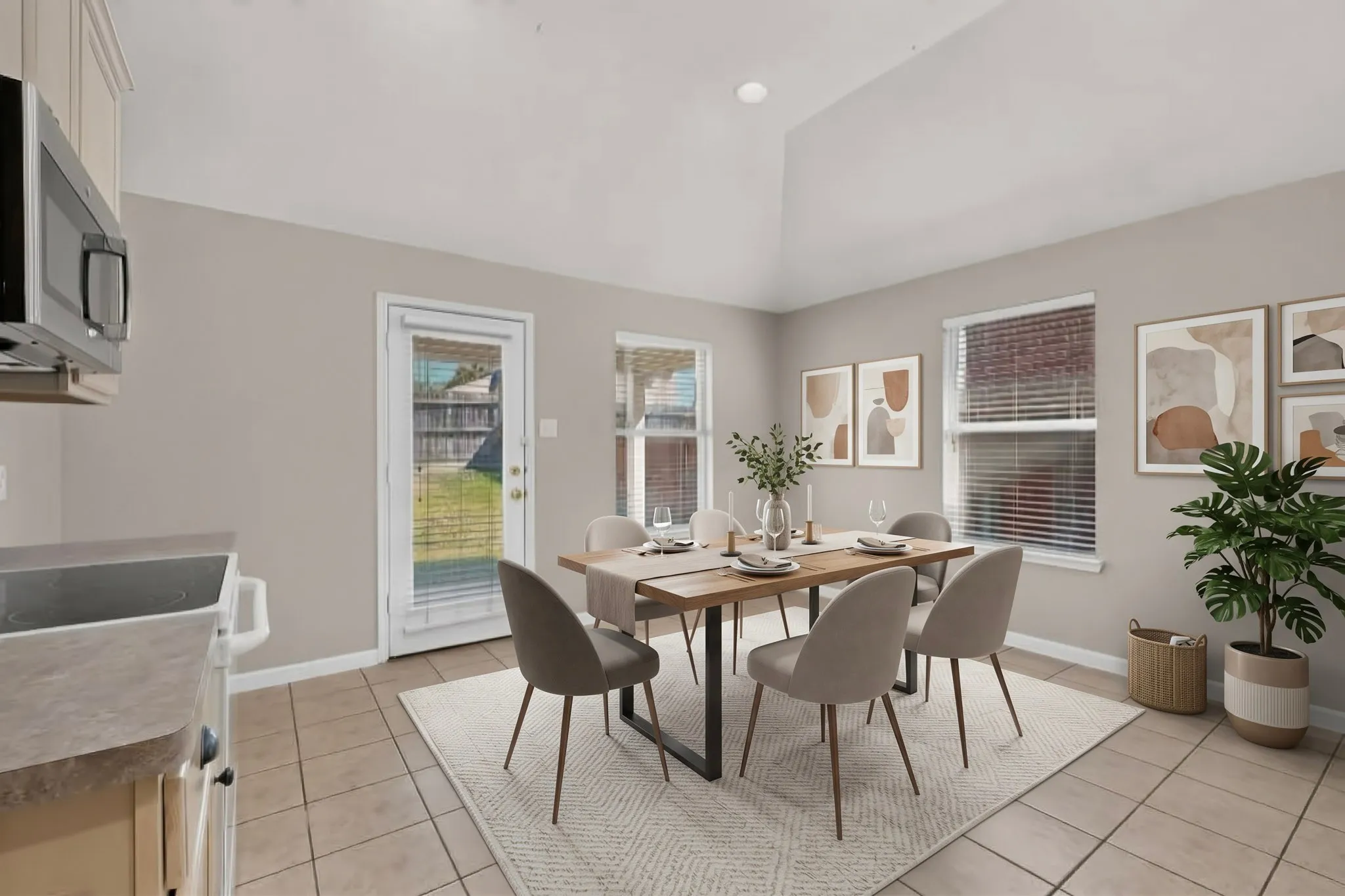Vaulted ceiling, multiple windows, tile flooring, glass-paneled door, recessed lighting