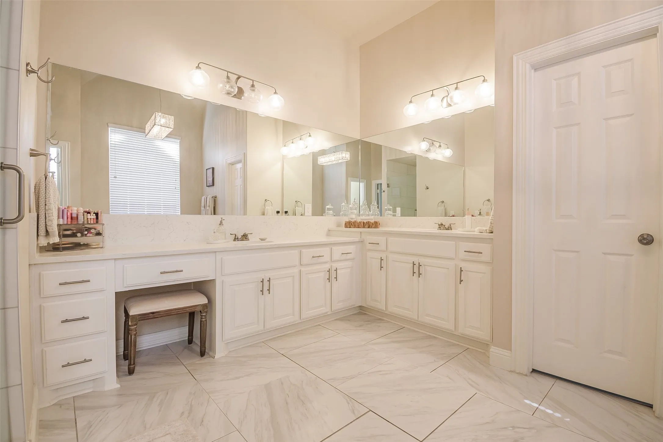 Dual vanity with white cabinetry, quartz-finish countertop, and integrated sinks