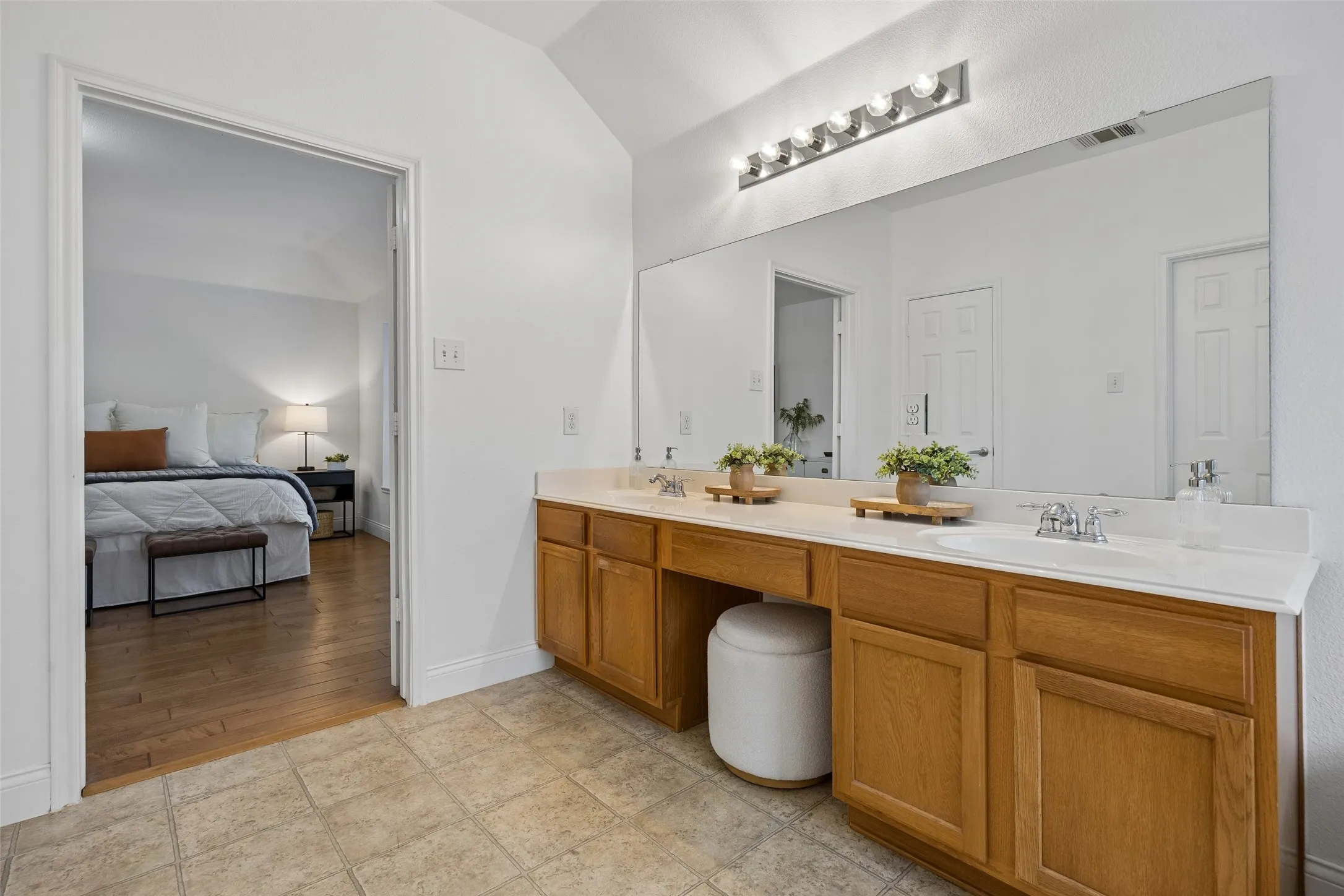 Dual vanities provide plenty of space for busy mornings and everyday routines.