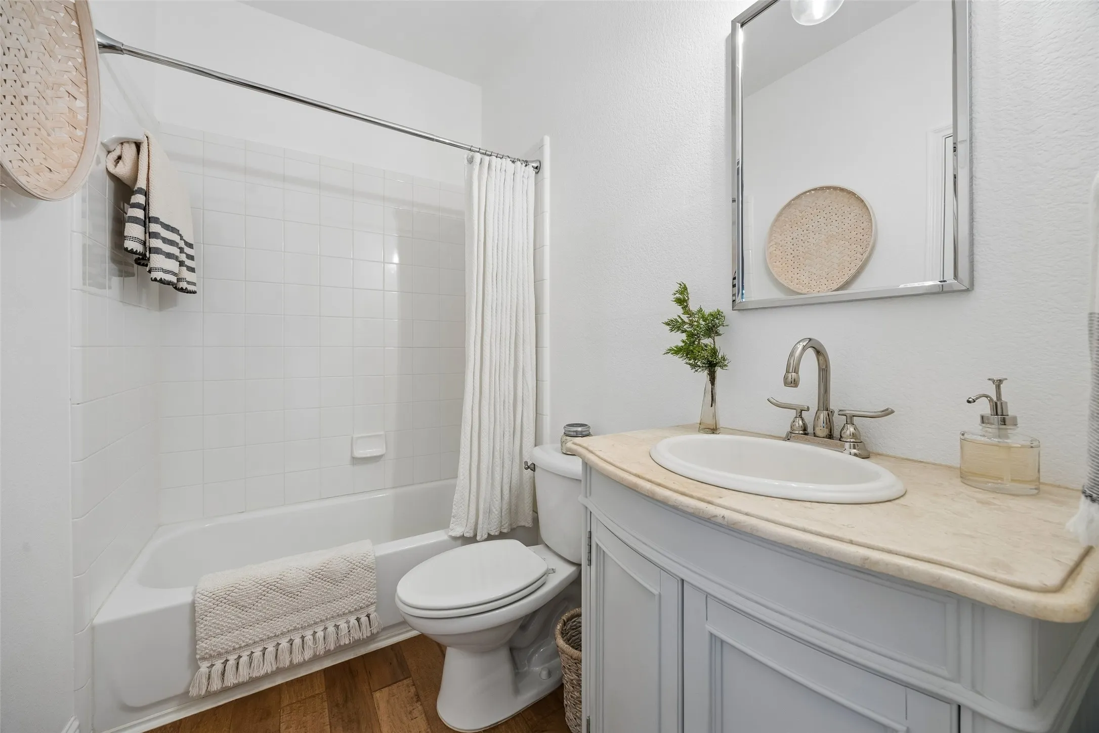 Beautifully updated guest bathroom with fresh, modern finishes.