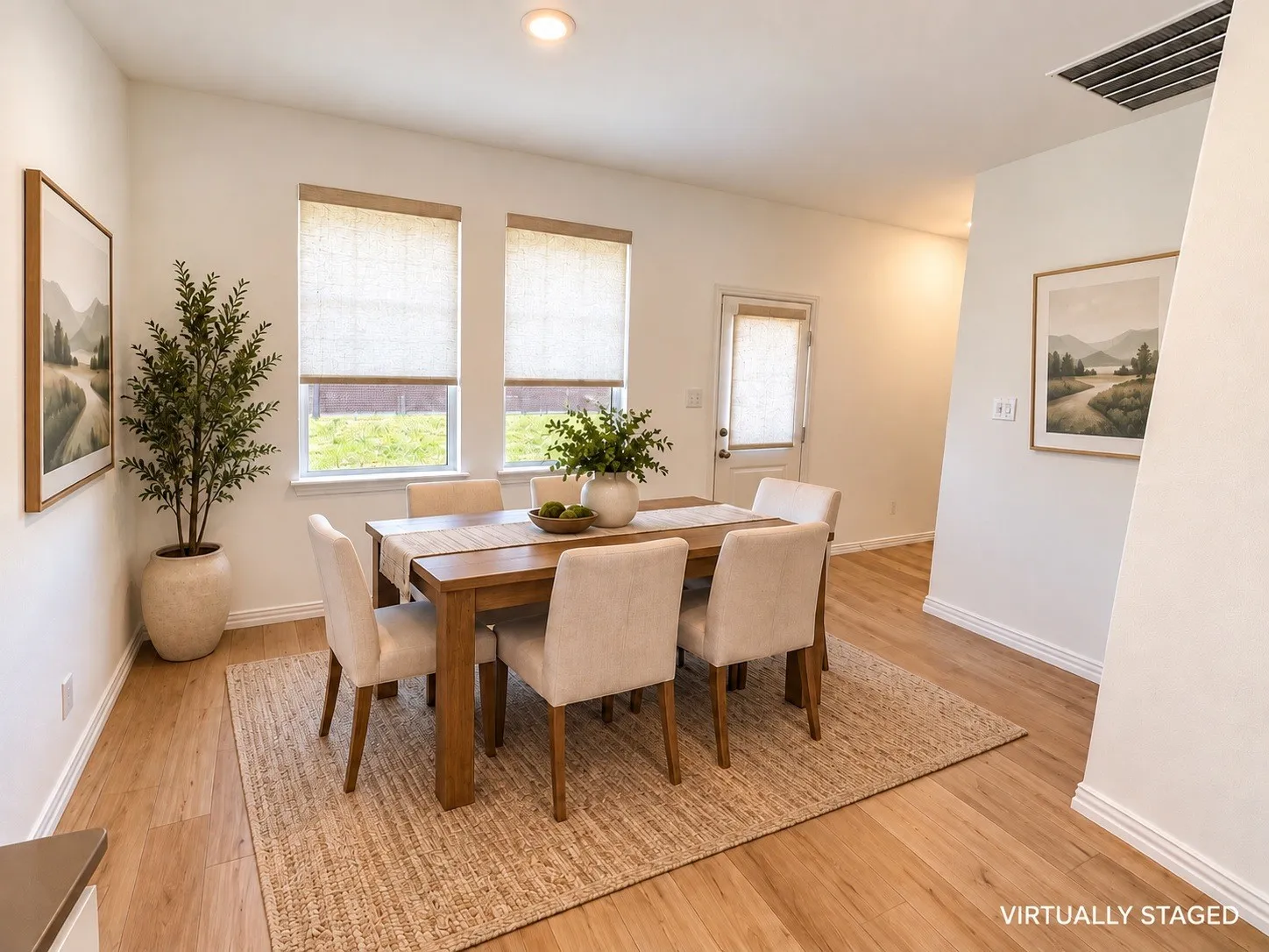 Light wood-finish flooring, recessed ceiling lighting, and white walls