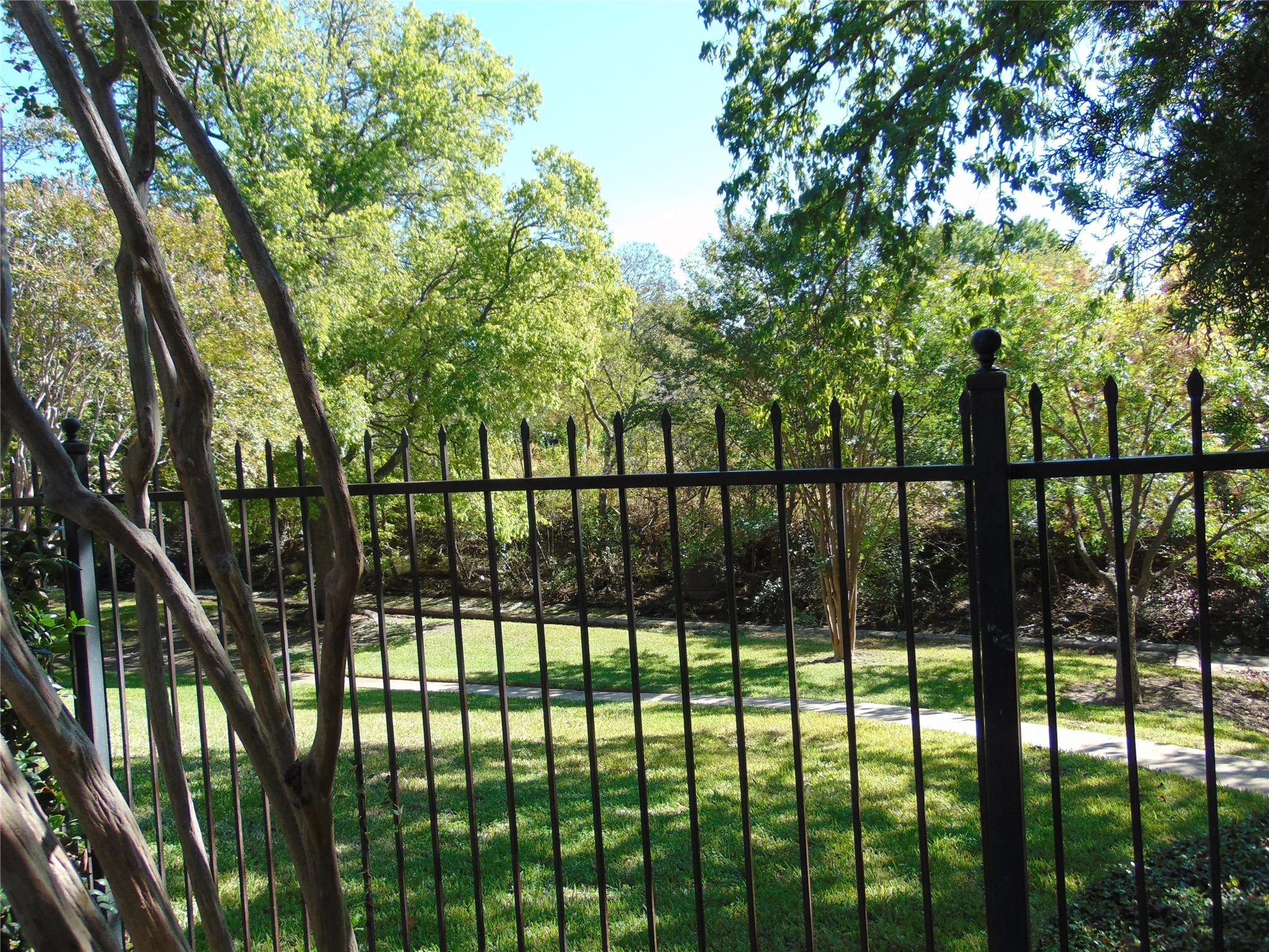 Overlooks walking trail and green belt.