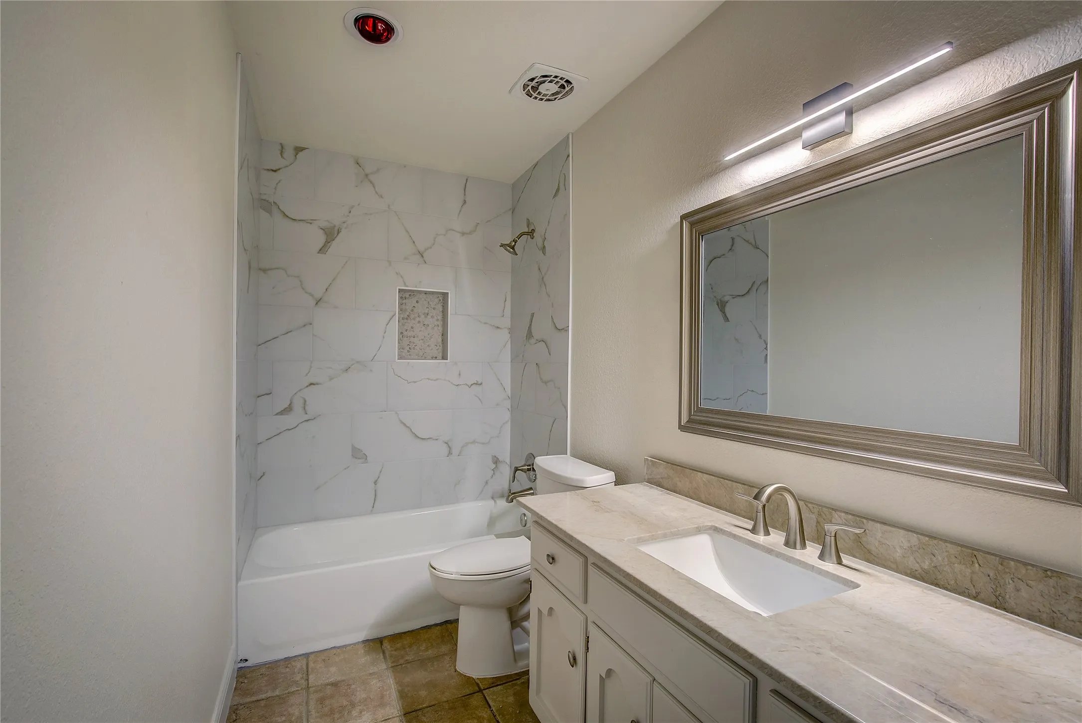 Hall bath is between Beds 2 & 3. New vanity, faucet, lighting, tub surround.
