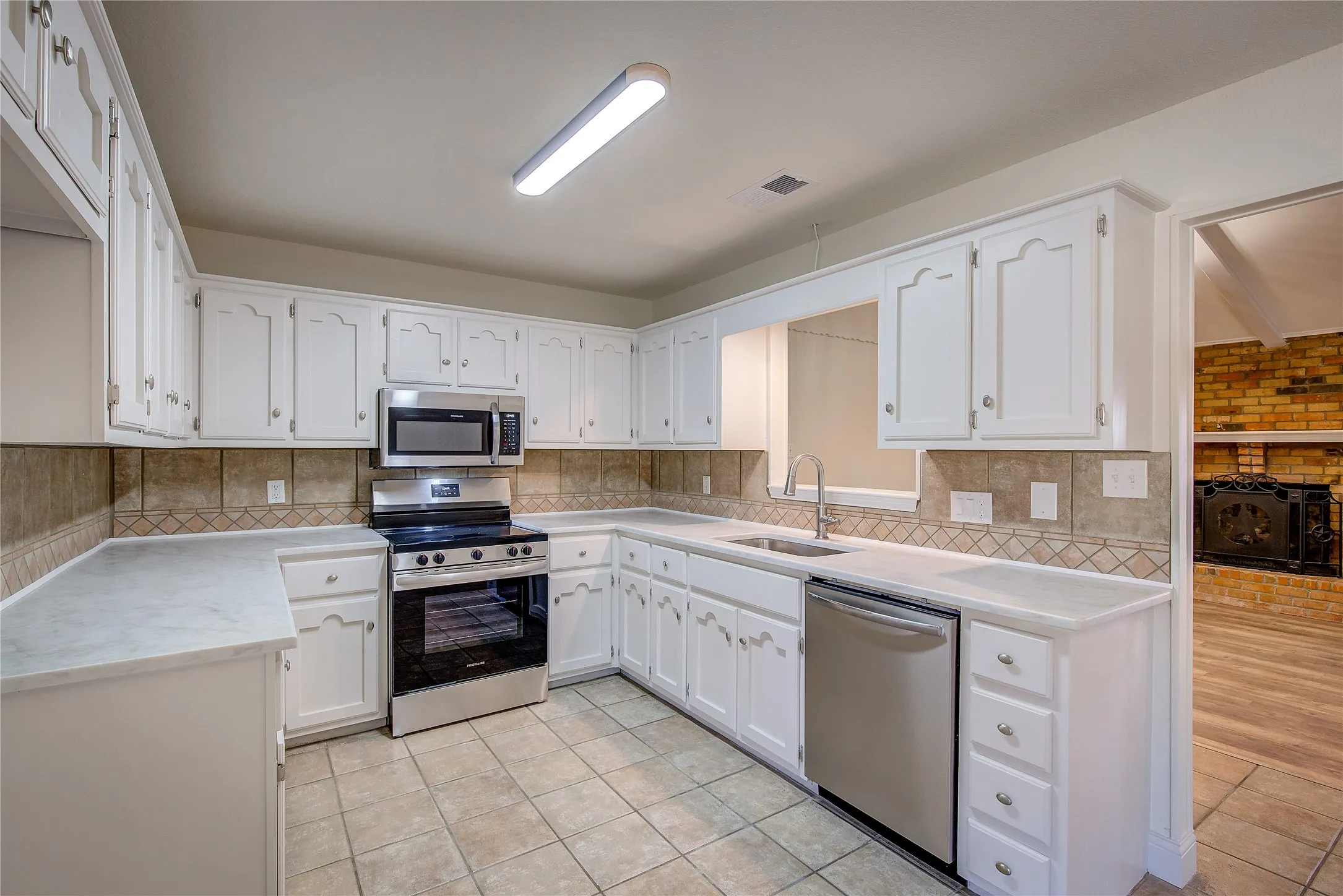 Kitchen updated with fresh paint, new granite counters, sink and backsplash, all new electric appliances.