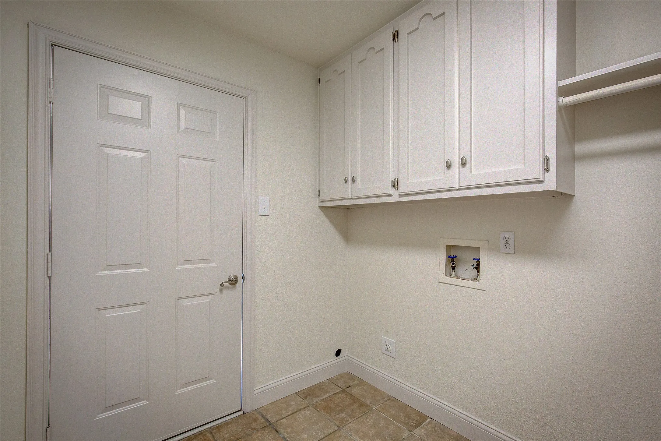 Laundry area has door to back yard, w/d space, hanging area or room for freezer