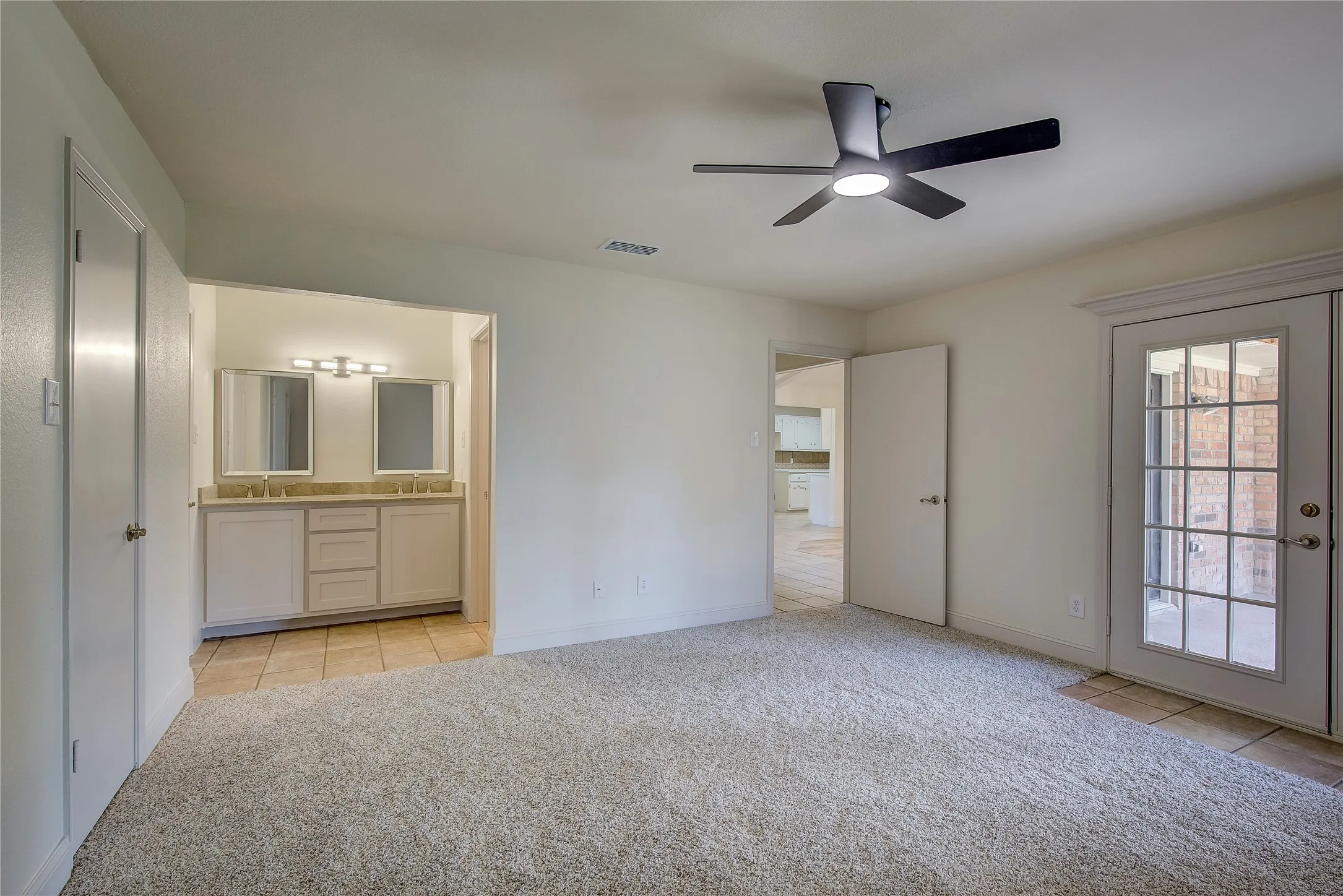Primary bedroom is at opposite end of house from other 2 bedrooms.