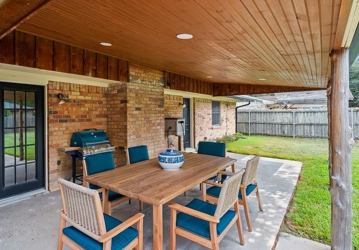Virtually staged. Great covered back porch with lots of room for seating or outdoor dining.