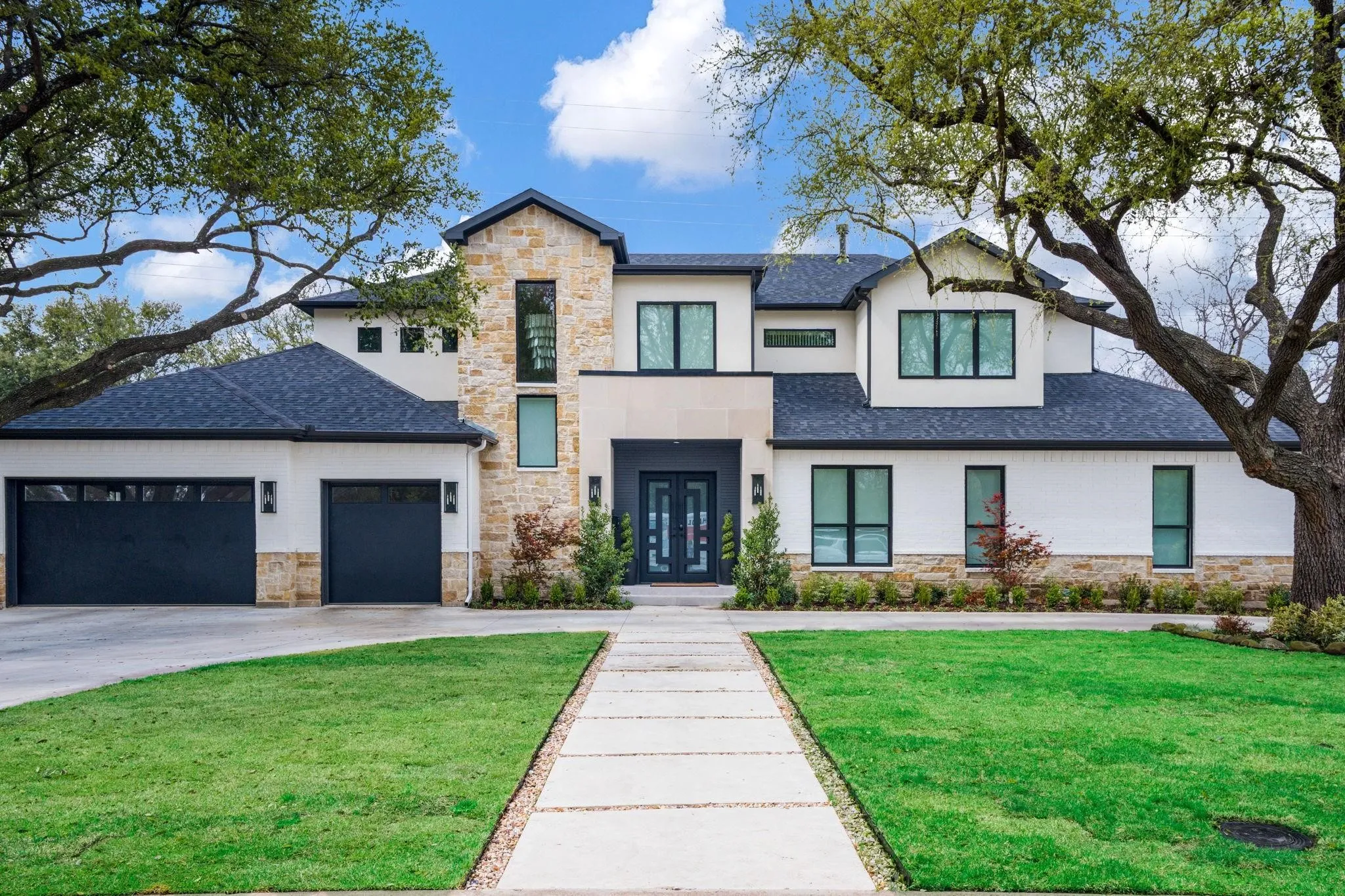 Stone and stucco exterior with multiple gables