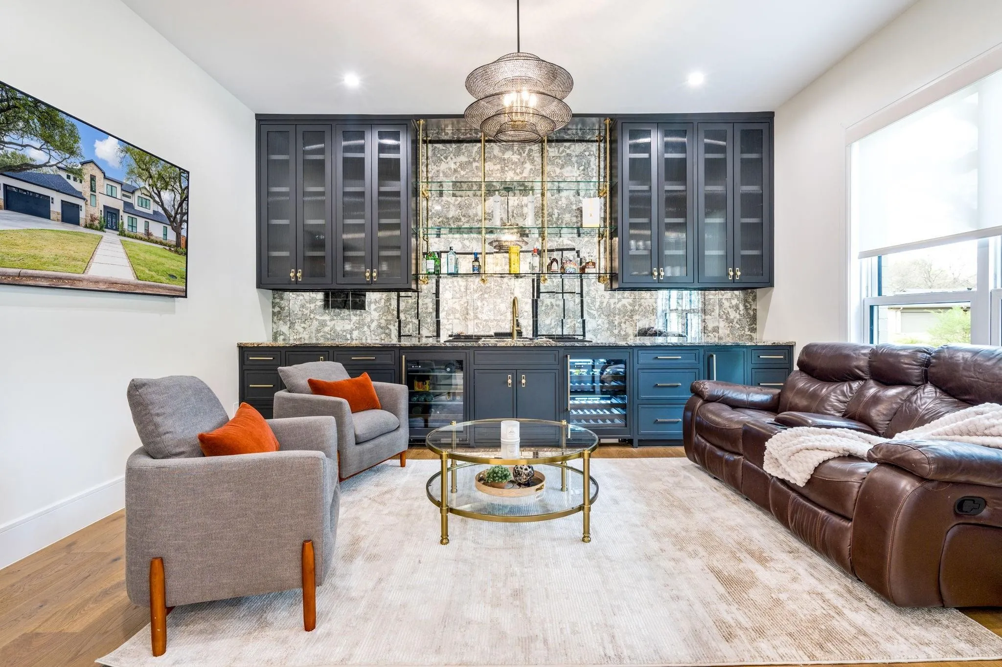 Built-in wet bar with dark cabinetry, glass-front upper cabinets, and integrated beverage refrigerators