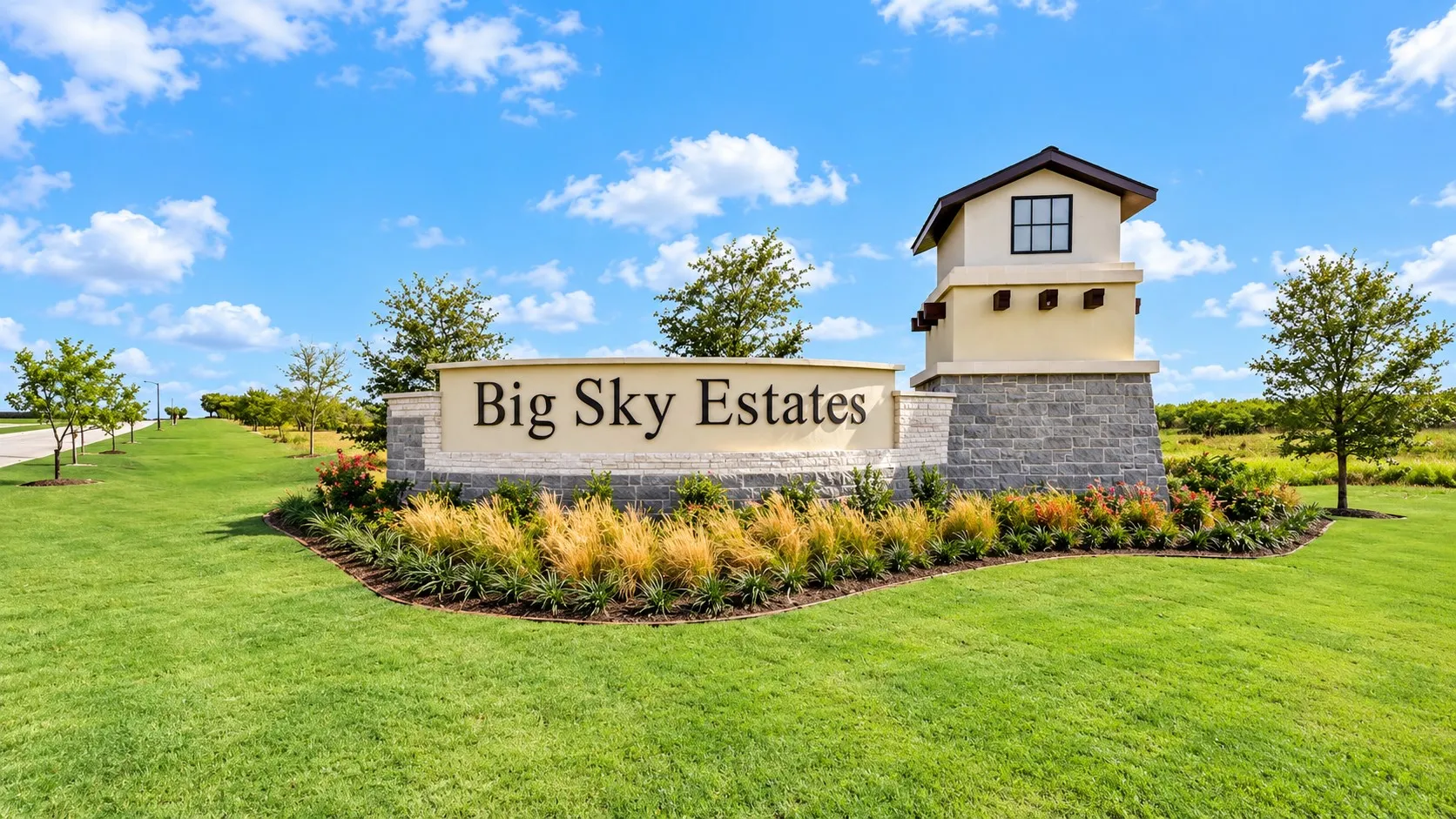 Community entrance featuring a stone and stucco sign with integrated lighting, a decorative tower element, manicured lawns, and mature landscaping