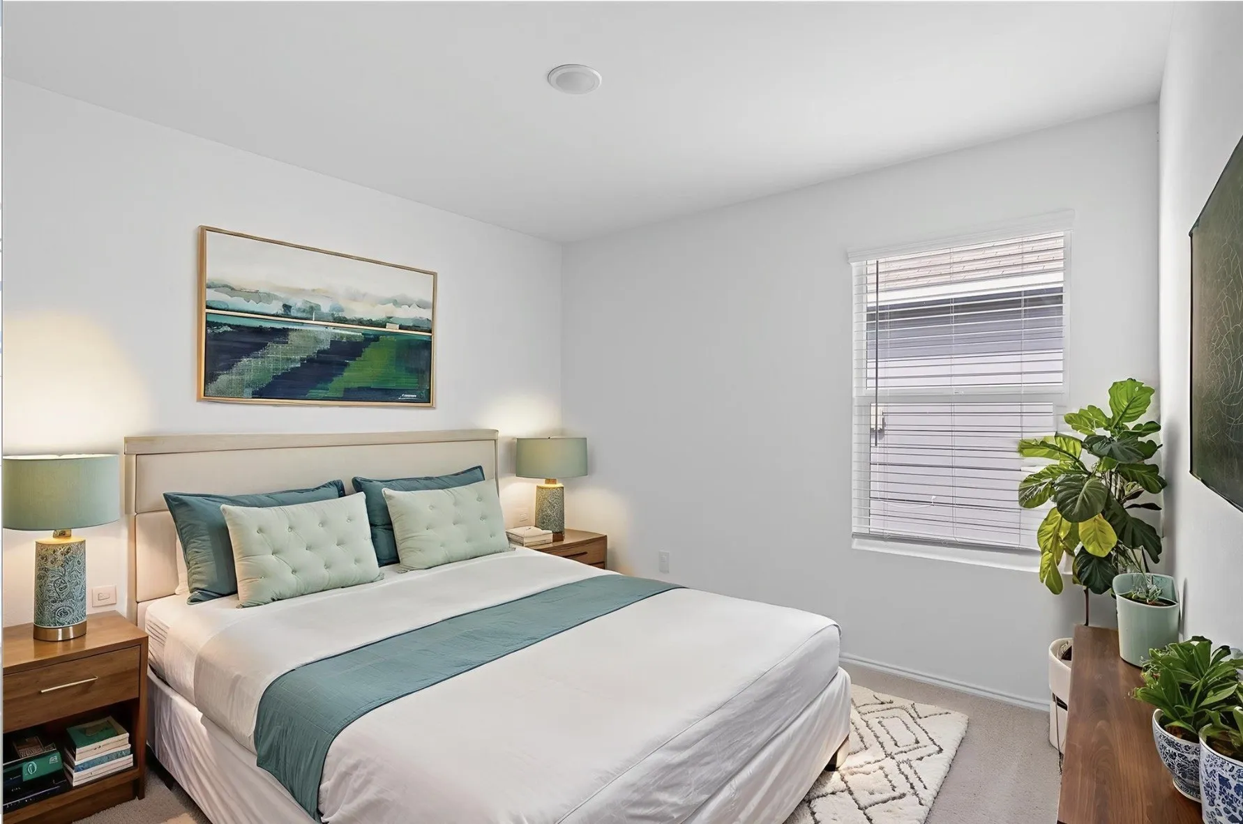 Recessed ceiling lighting, window with blinds, light-colored walls, and wood-finish flooring