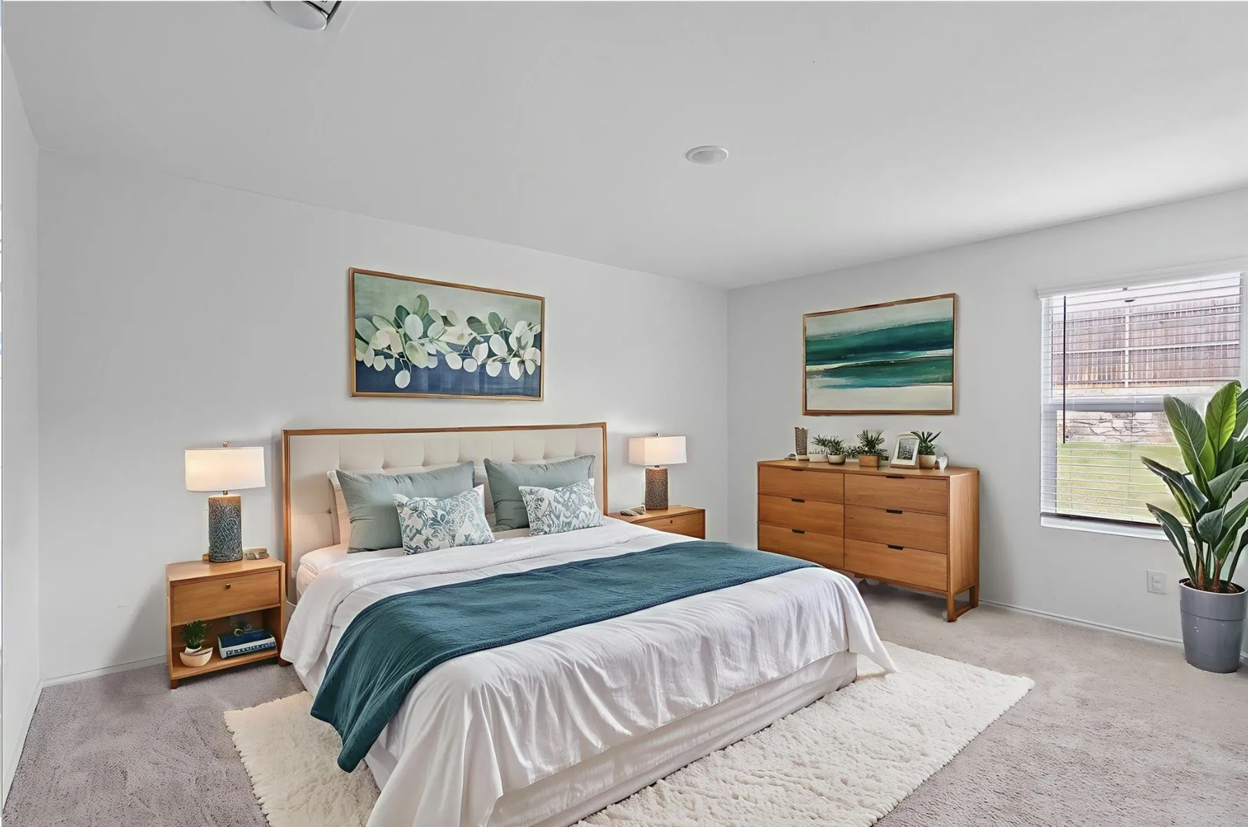Recessed lighting, window with horizontal blinds, neutral wall tones, and carpet flooring