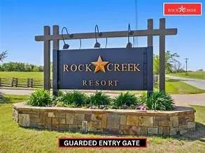 Stone veneer base with integrated landscaping