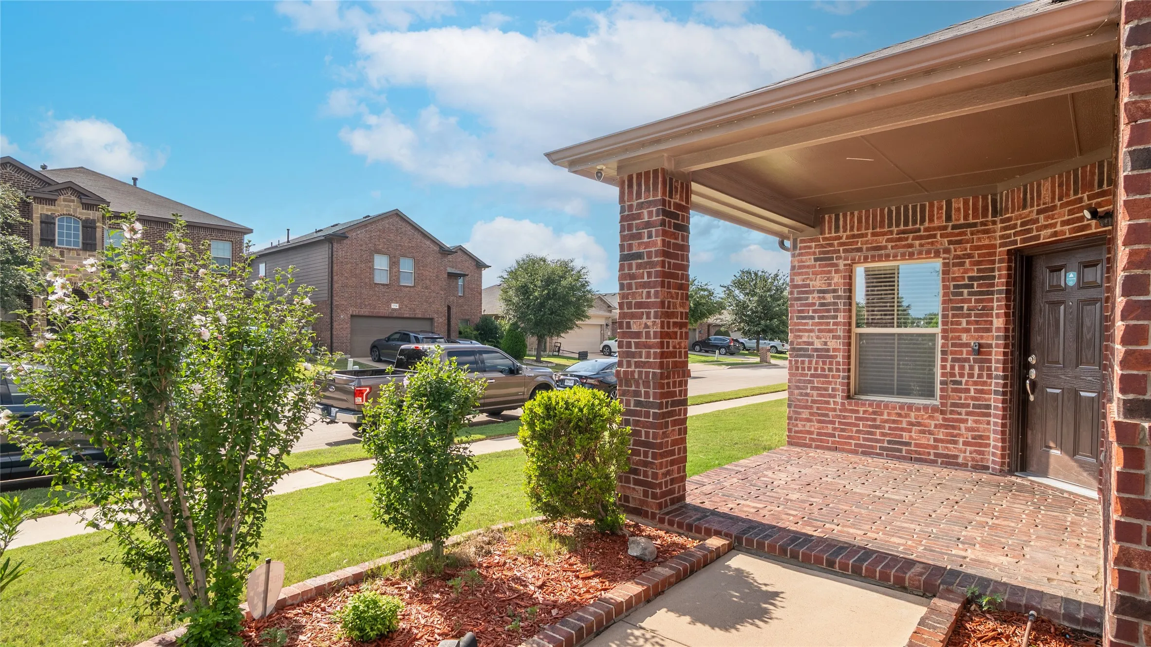 Brick exterior with covered entry