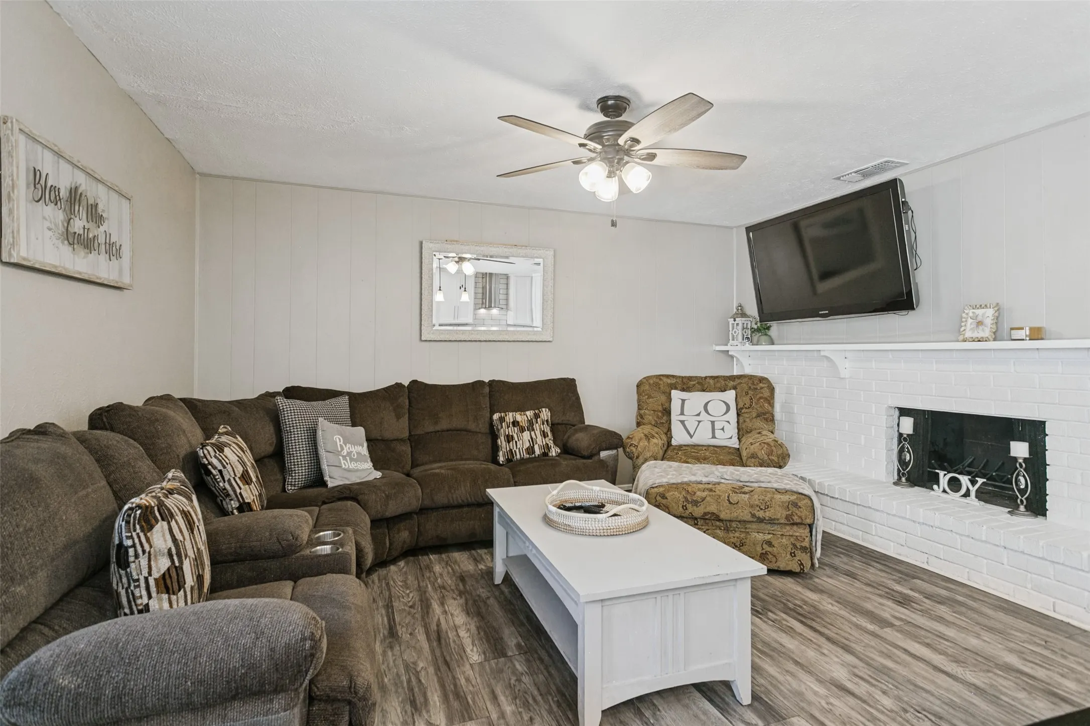 White brick fireplace with mantel