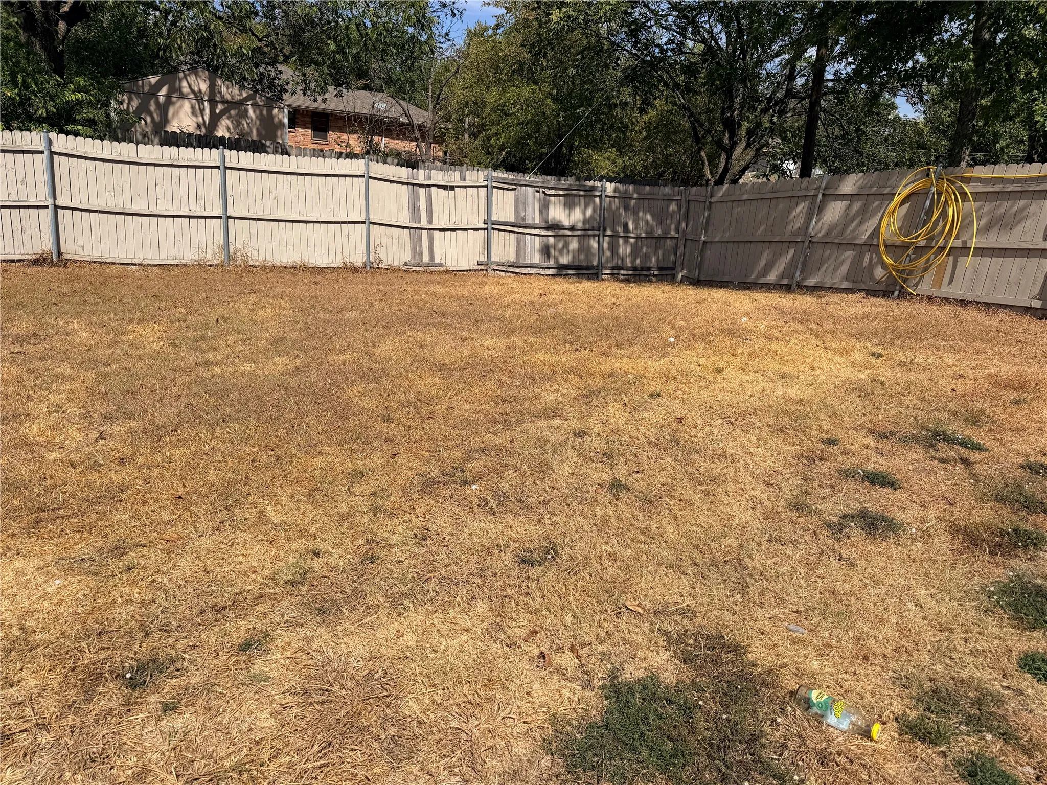Expansive outdoor area with a perimeter fence