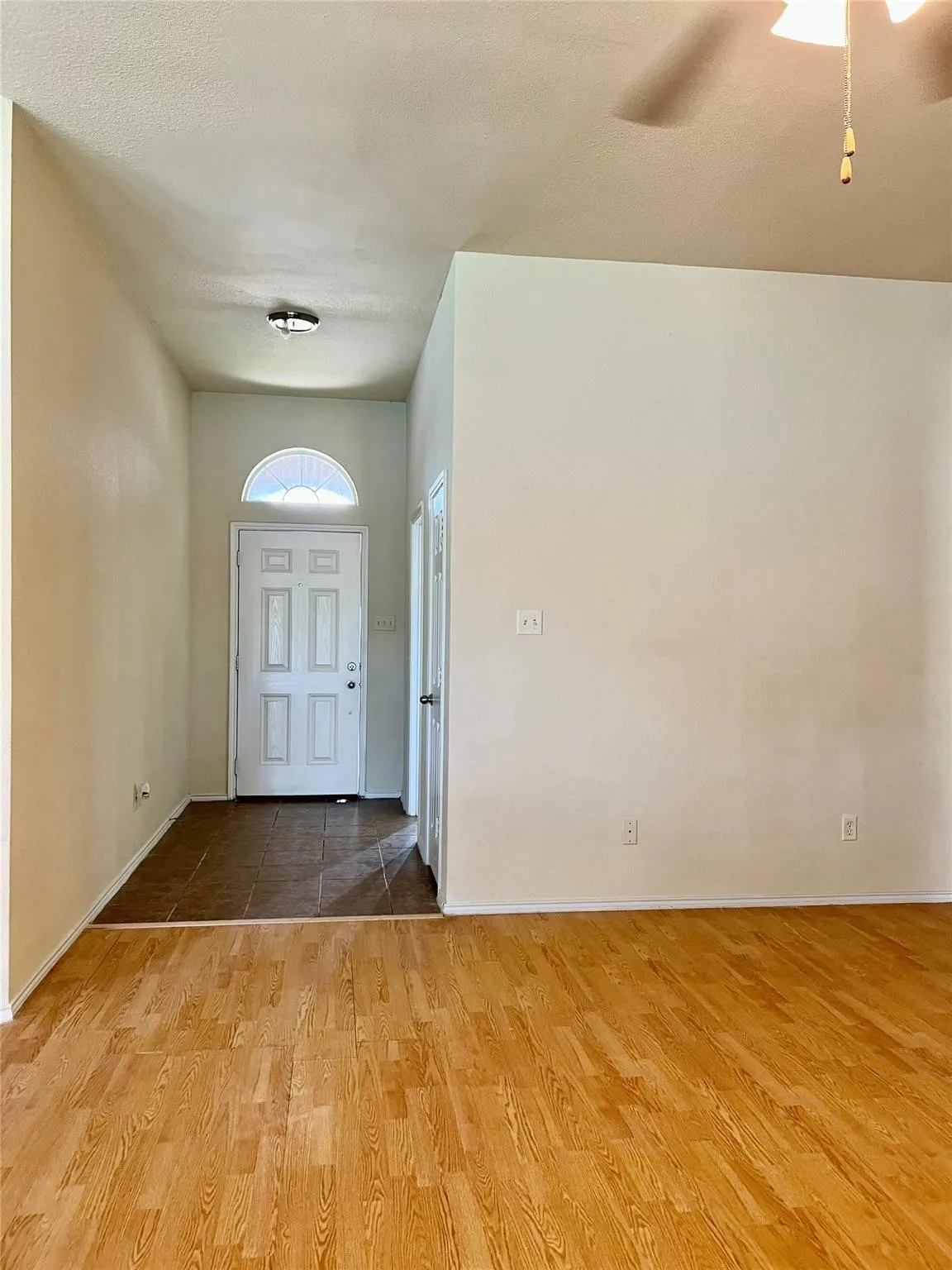 Entryway featuring wood-finish flooring and tile flooring