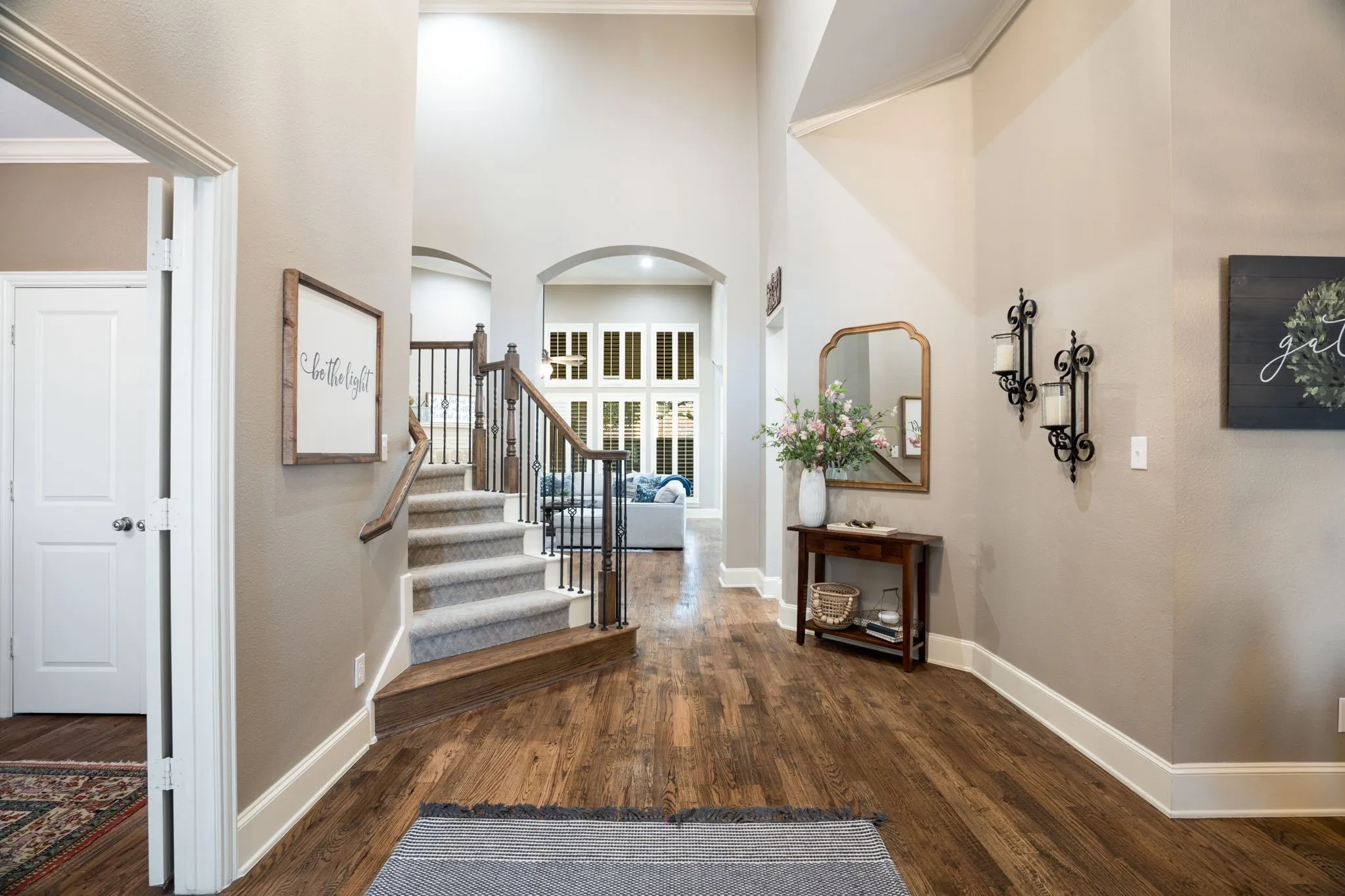 Entrer into a tall ceilings and open foyer
