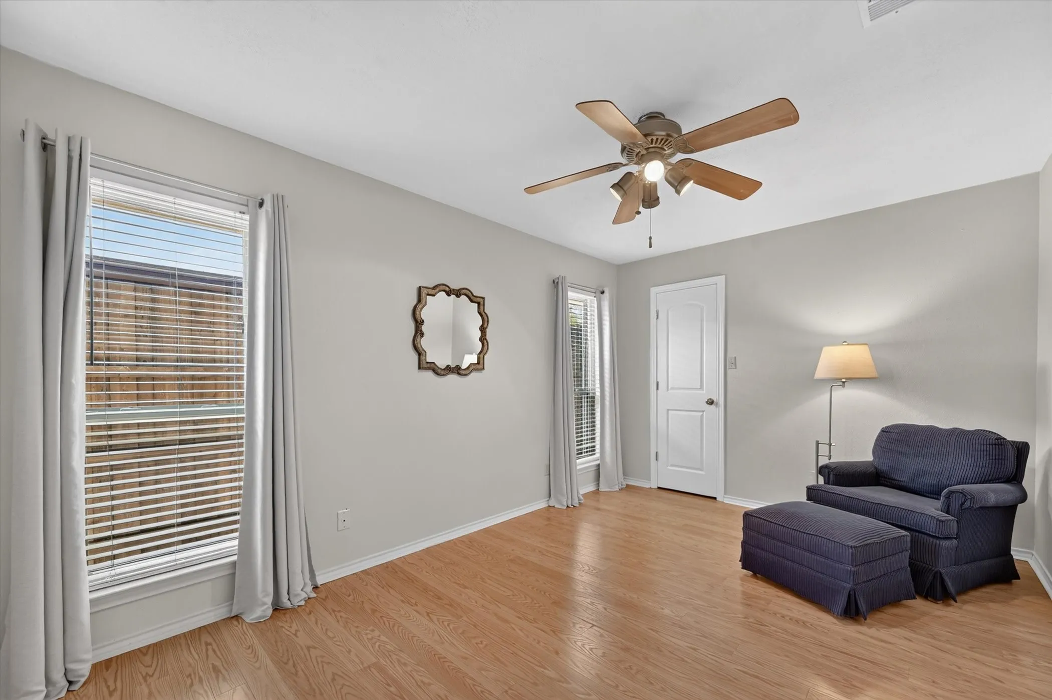 One of two downstairs secondary bedrooms. This one has hardwood floors and a walk in closet.