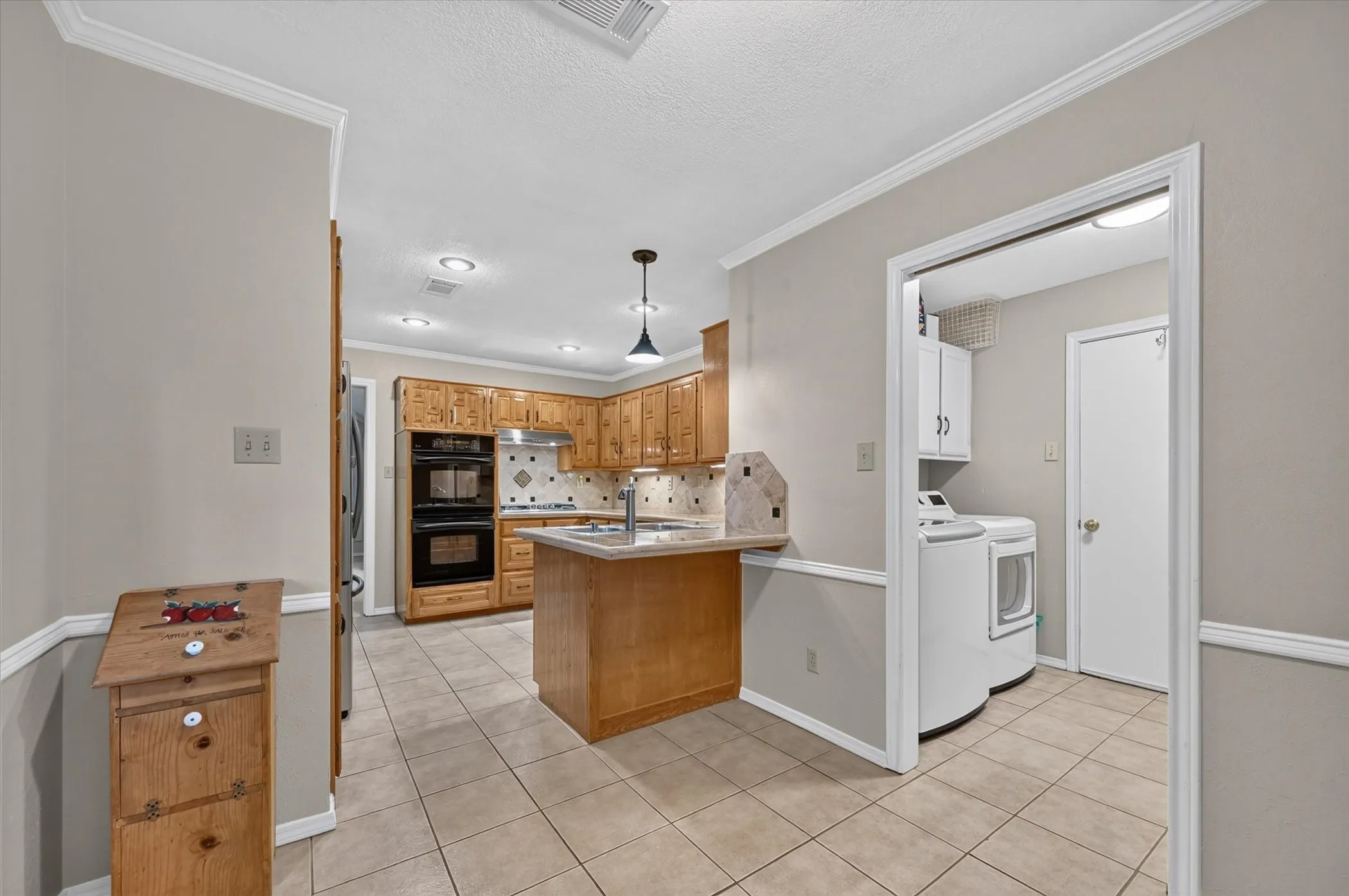 The cute breakfast area is an extension of the kitchen.