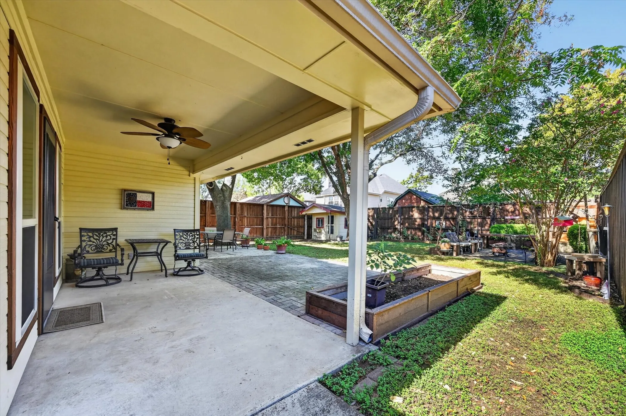 The patio is extended to offer a larger area for entertaining. There is a raised flower bed if you want to plant a vegetable garden.