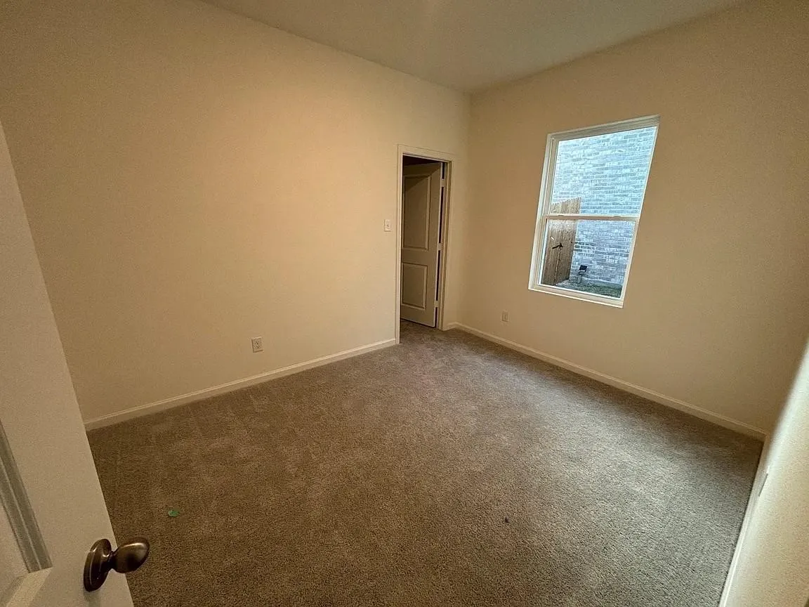 Neutral wall tones and carpeted flooring
