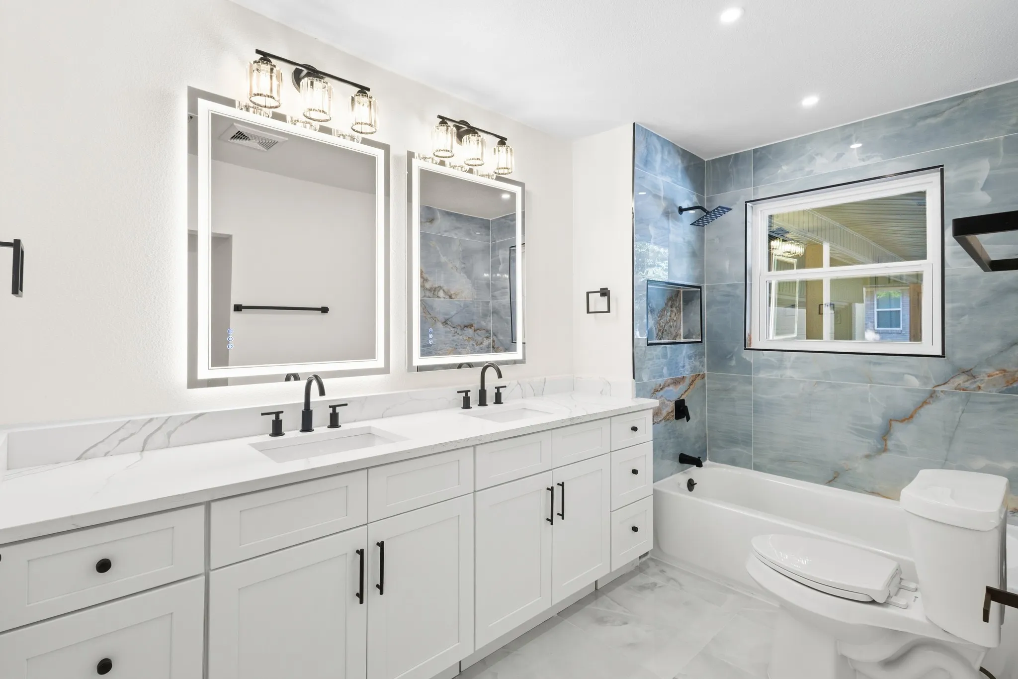 WOW effect, brilliant blend of high-end blue tiles and white quartz countertops with white cabinetry