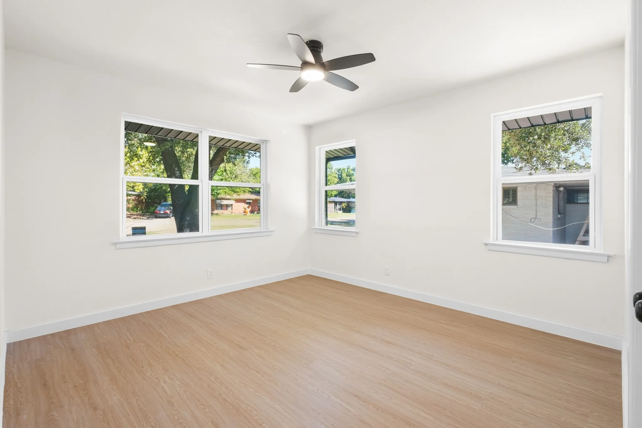 Bedroom with brand new windows, new ceiling fan and walk in closet
