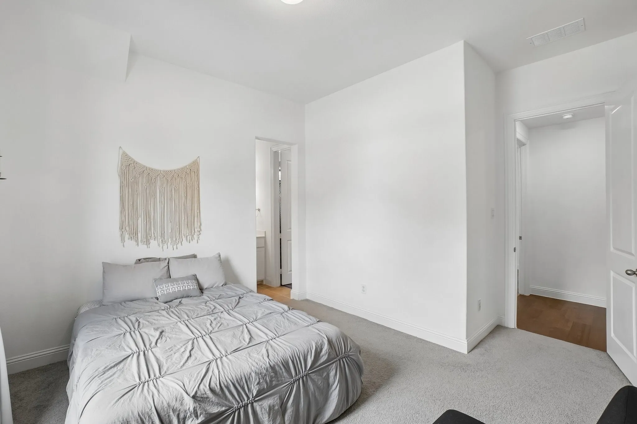 Recessed lighting, carpet flooring, and white interior walls