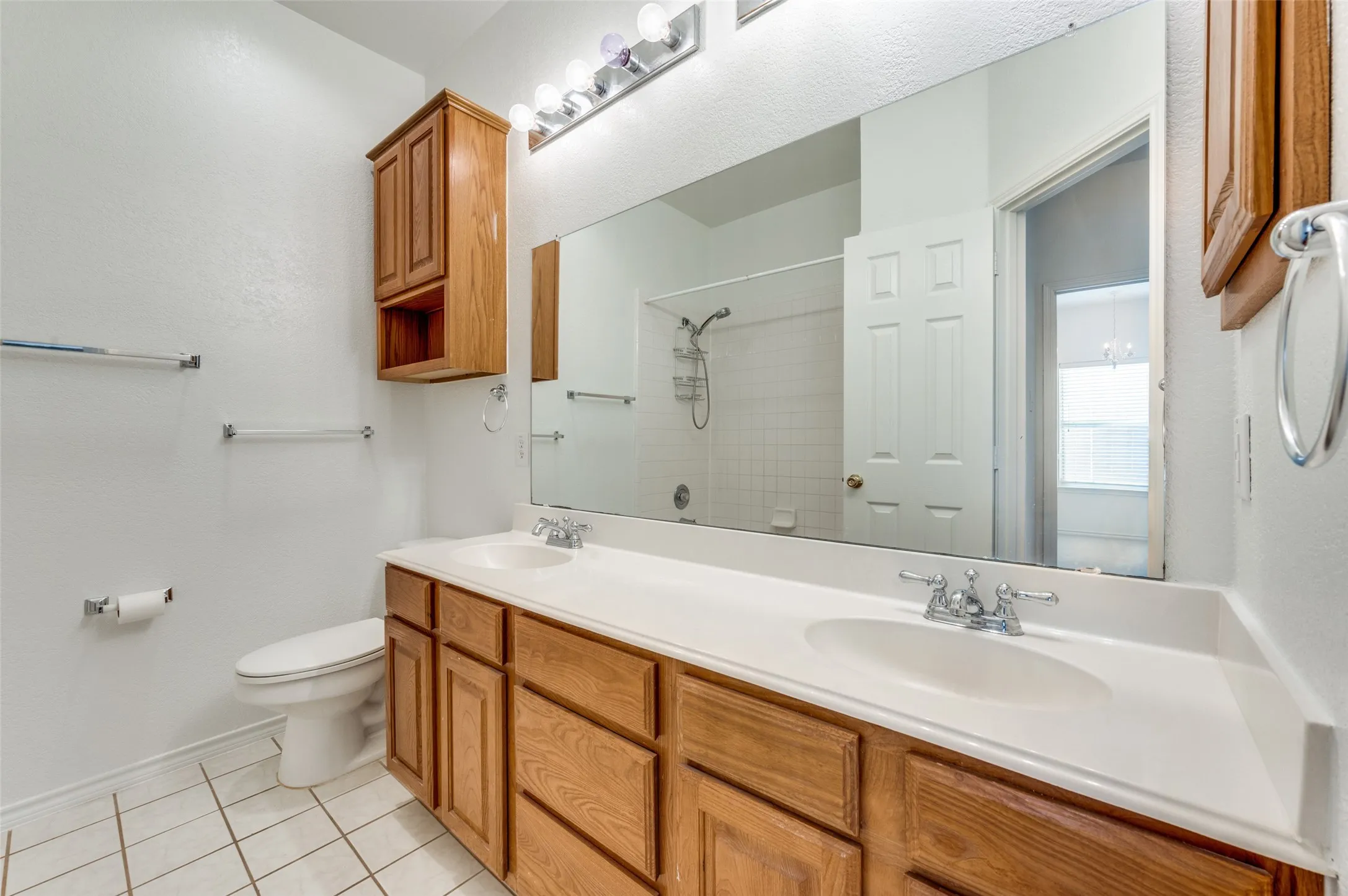 Double vanity with integrated sinks and chrome fixtures