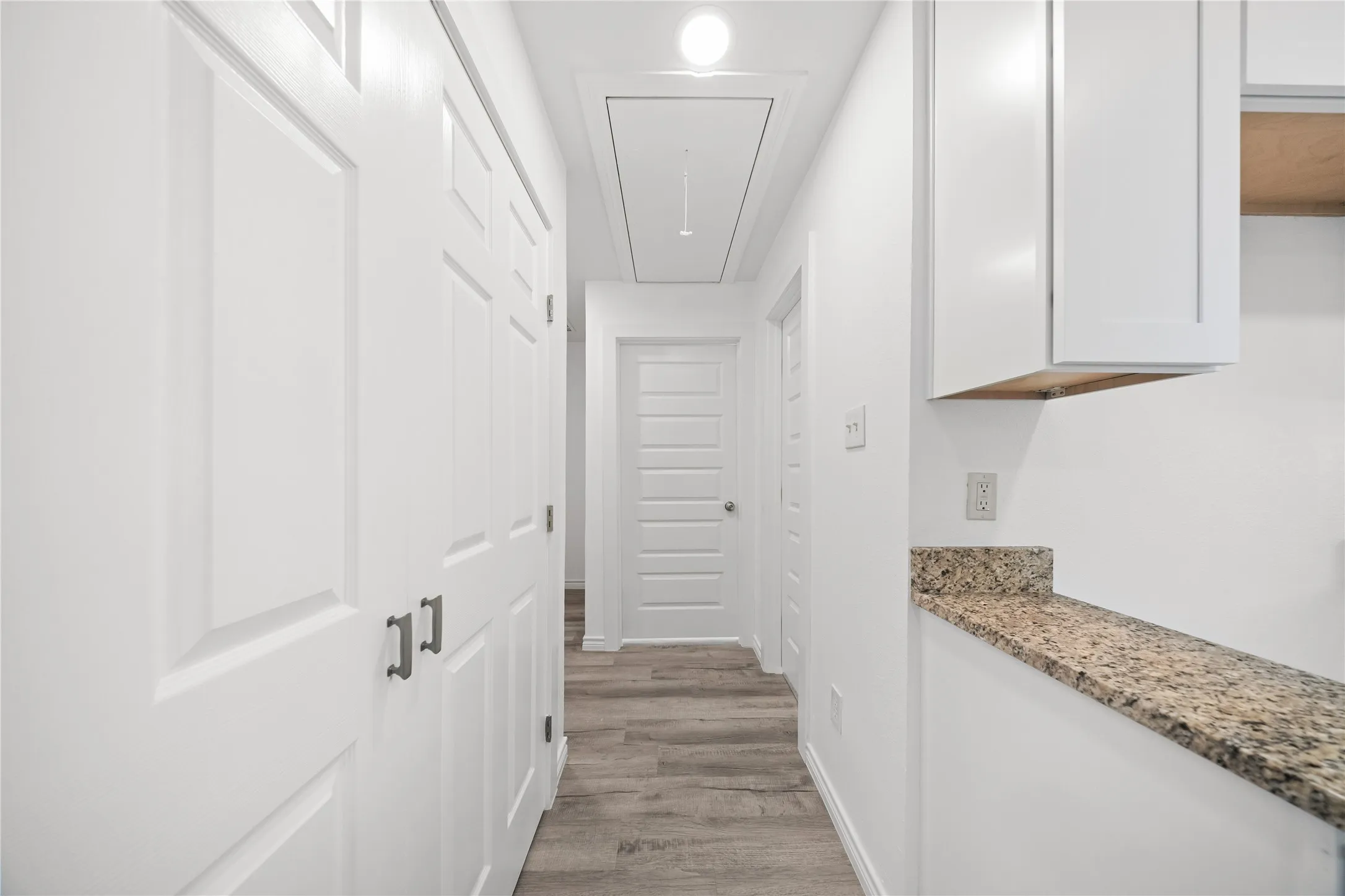 hallway to 3 bedrooms, full bath, and laundry
