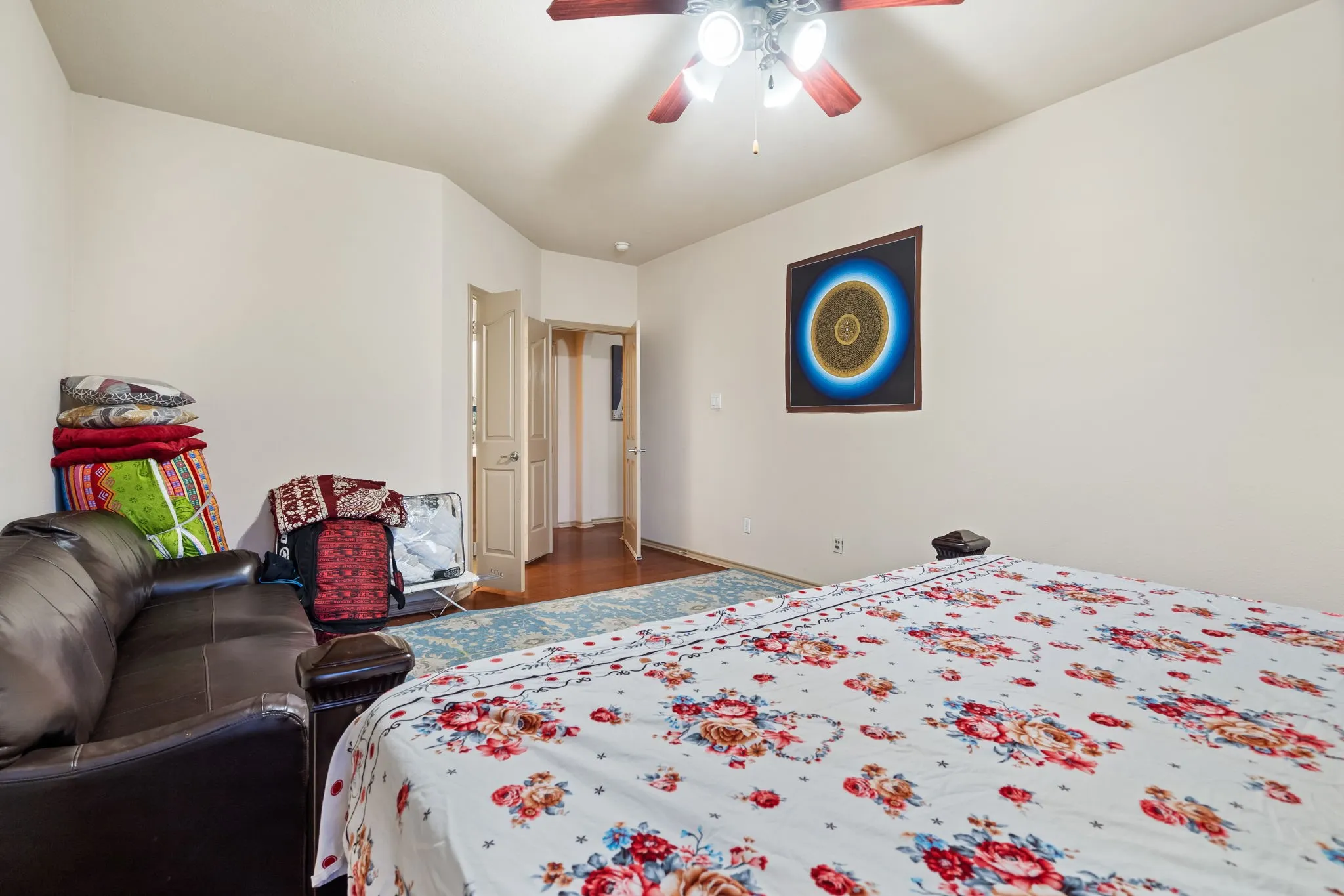 Primary Bedroom with lots of natural light and ceiling fan