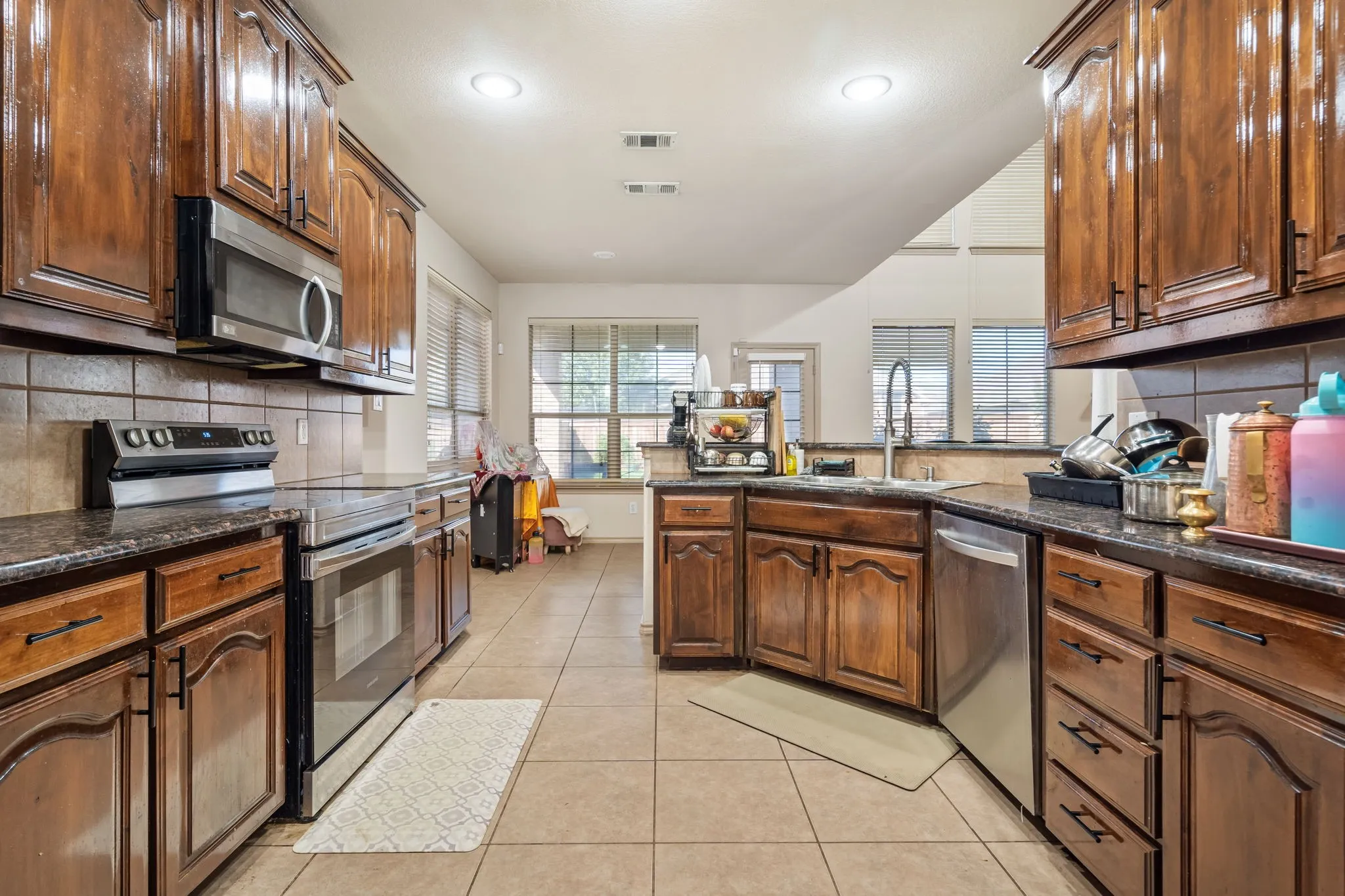 View of Kitchen, Breakfast Bar and Breakfast Nook from the Dining Room