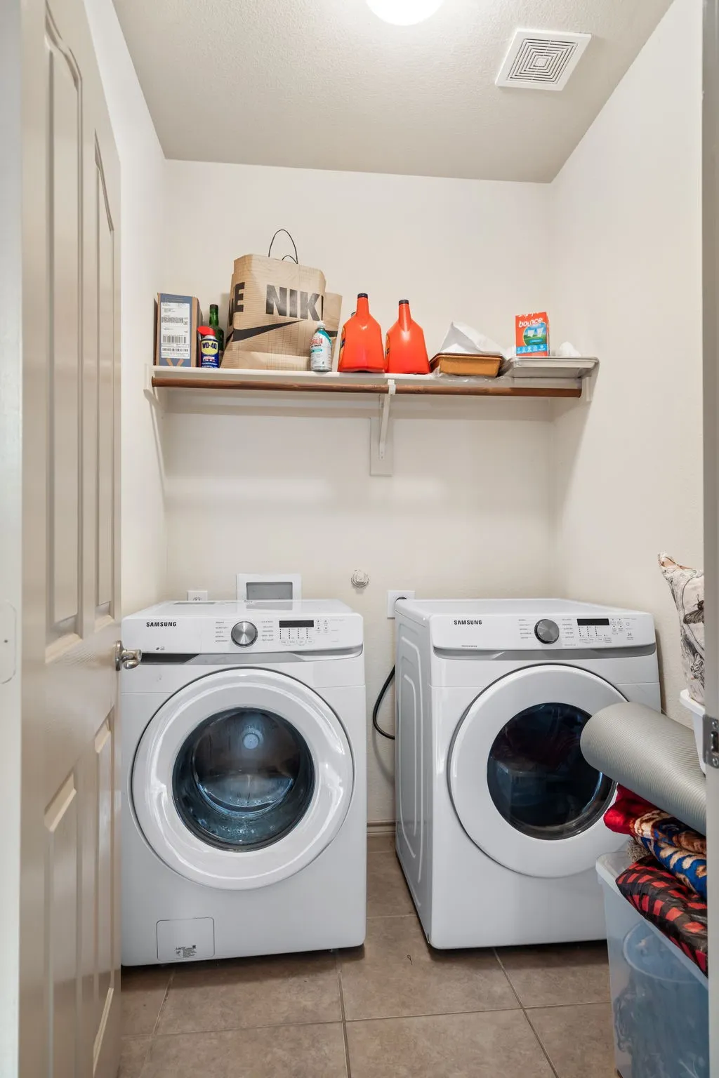 Laundry room downstairs with full size washer and dryer