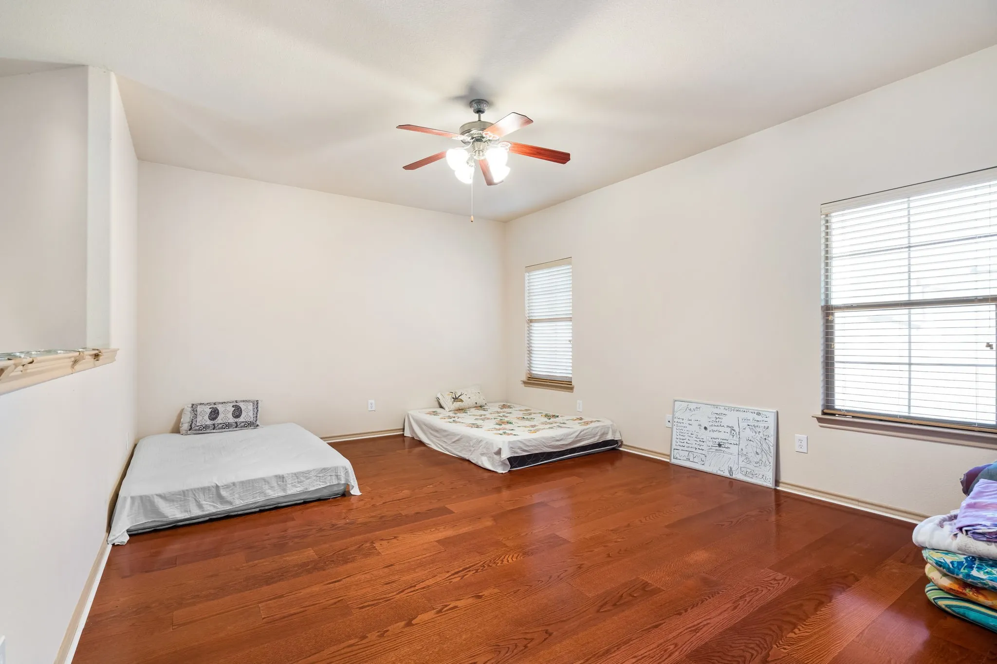 Game Room upstairs with lots of natural light and ceiling fan