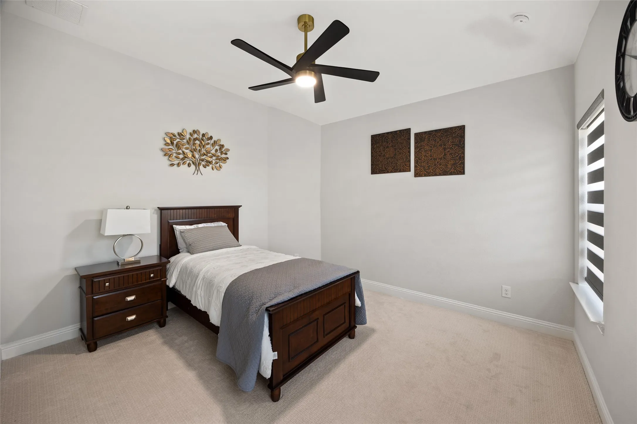 Recessed lighting, ceiling fan, carpeting, and window with blinds