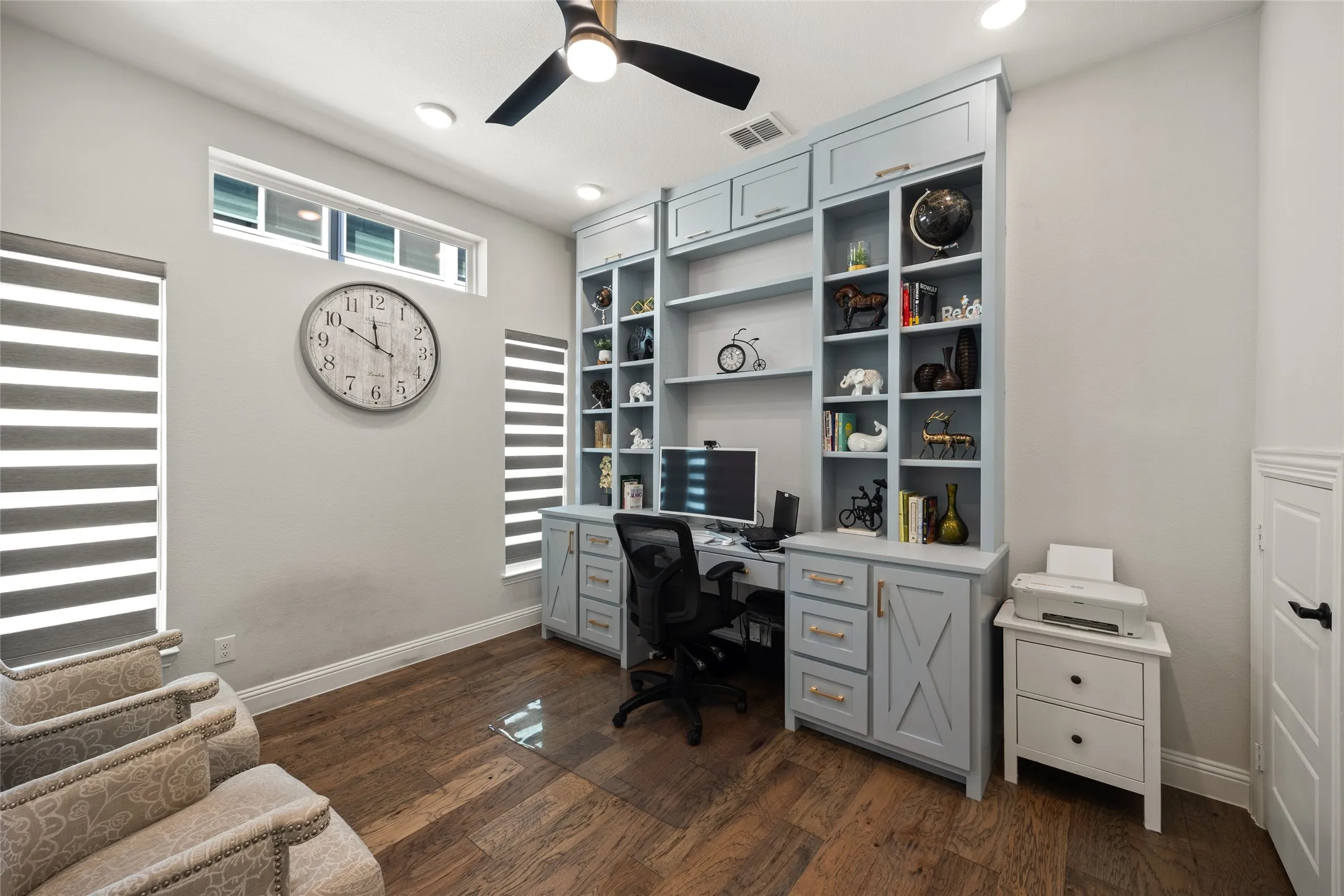 Built-in desk and shelving unit, wood-finish flooring, recessed lighting, ceiling fan, and horizontal blinds
