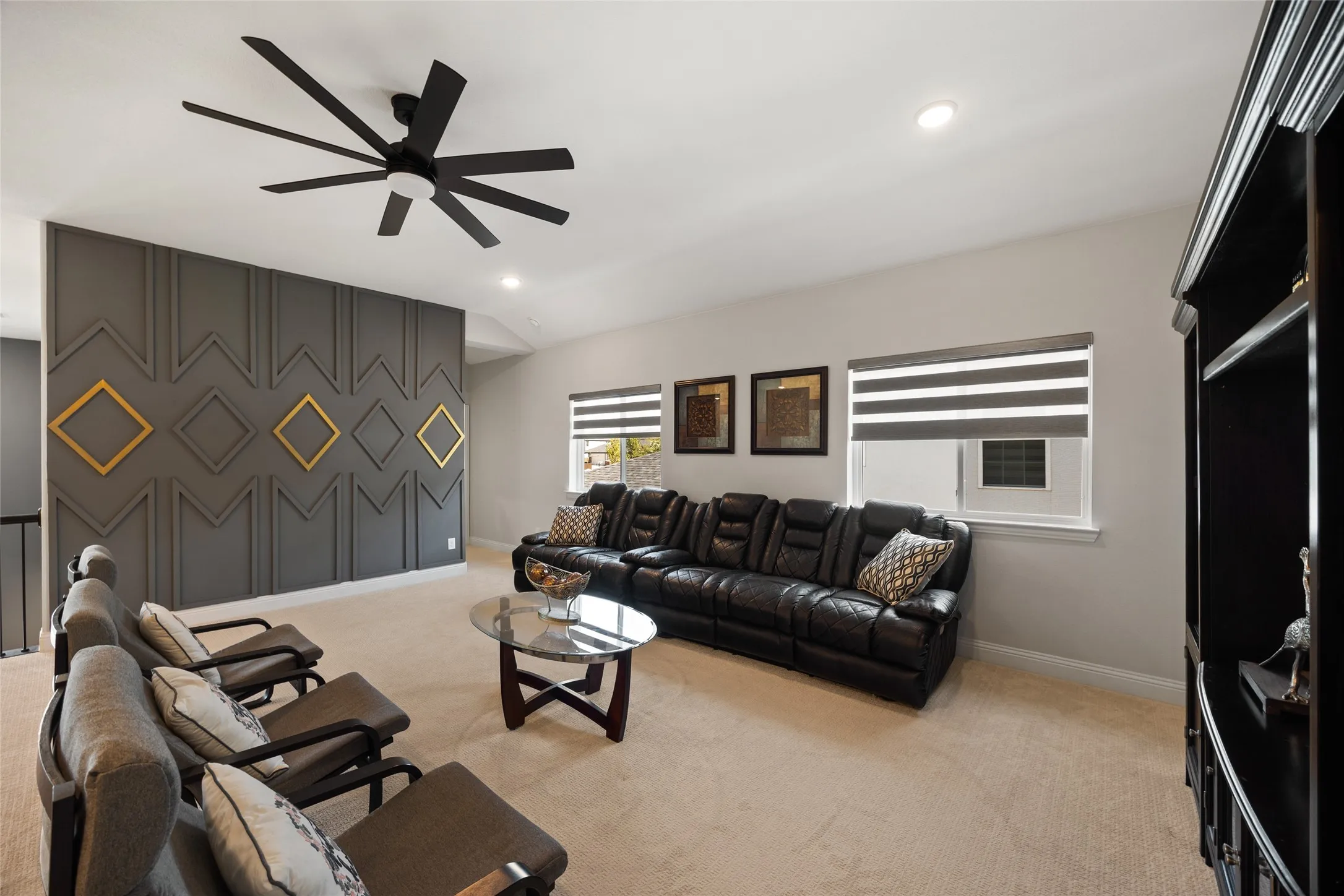 Accent wall featuring geometric paneling and gold-toned square inlays