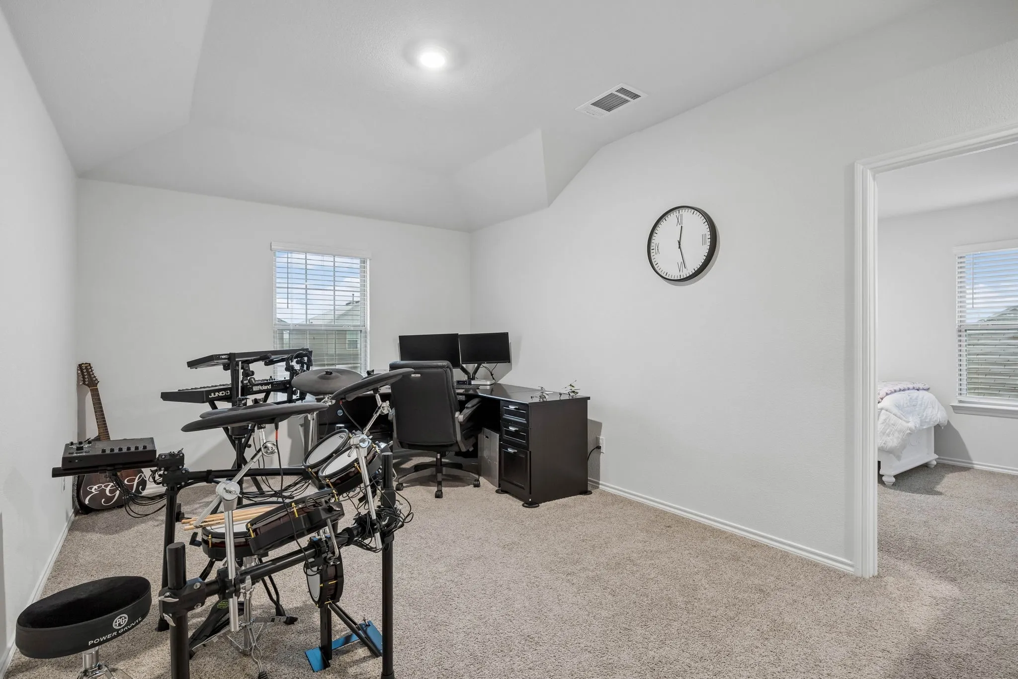 The upstairs game room is currently a home office