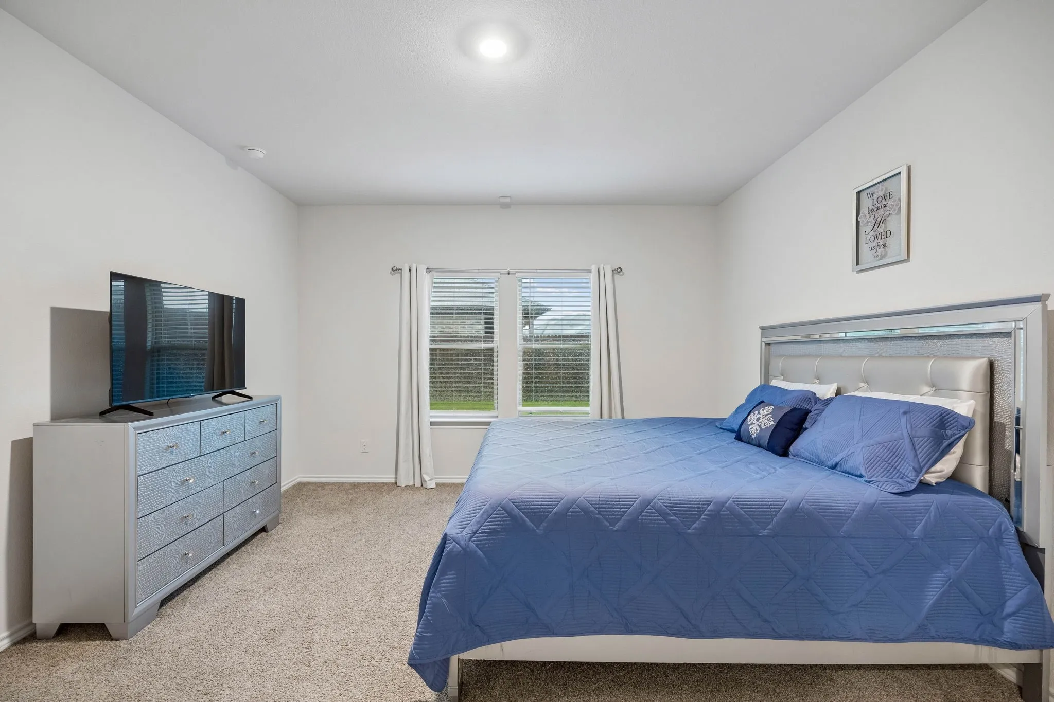 Another view of the primary bedroom