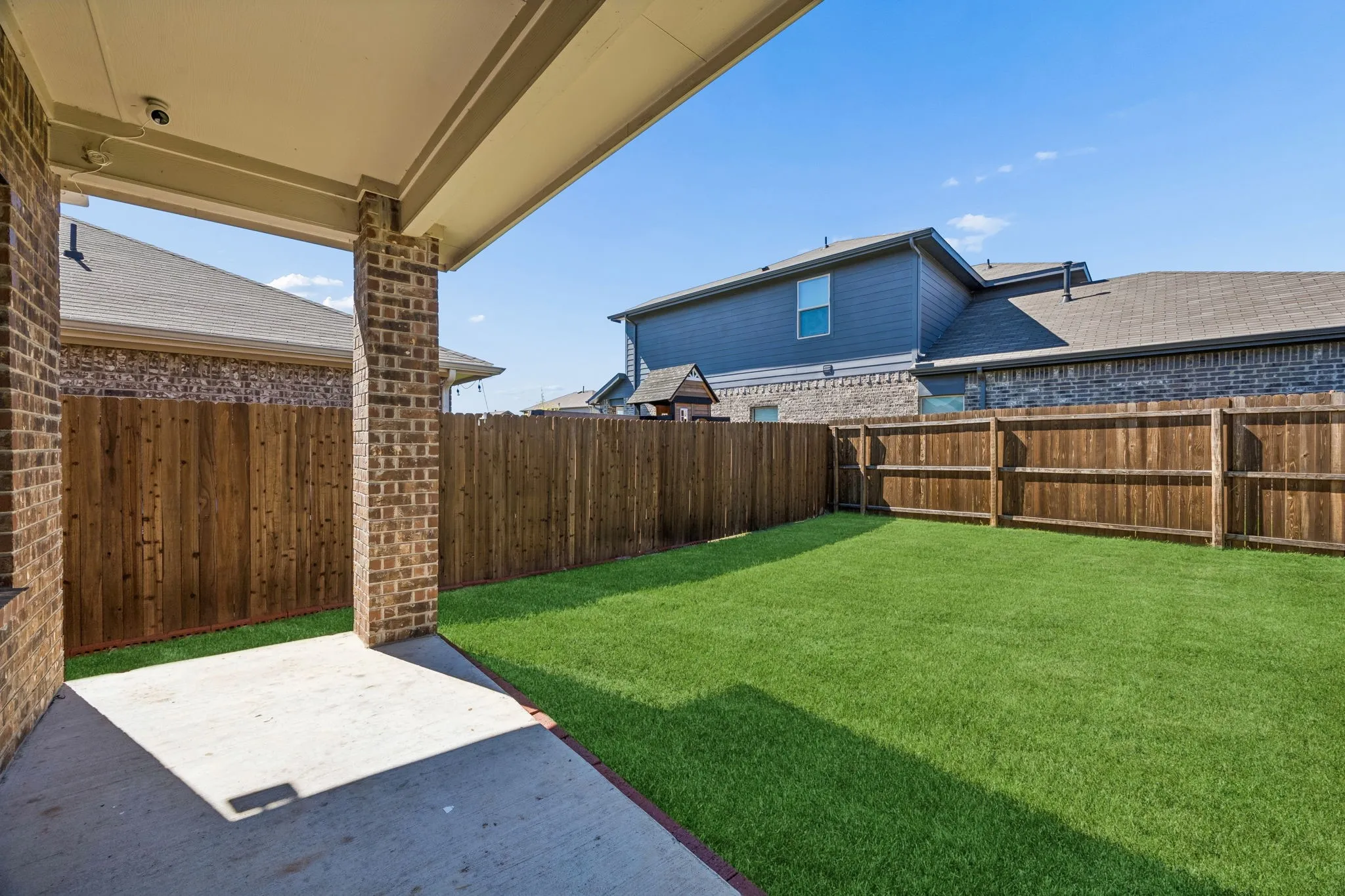 Looking into the back yard from the covered patio
