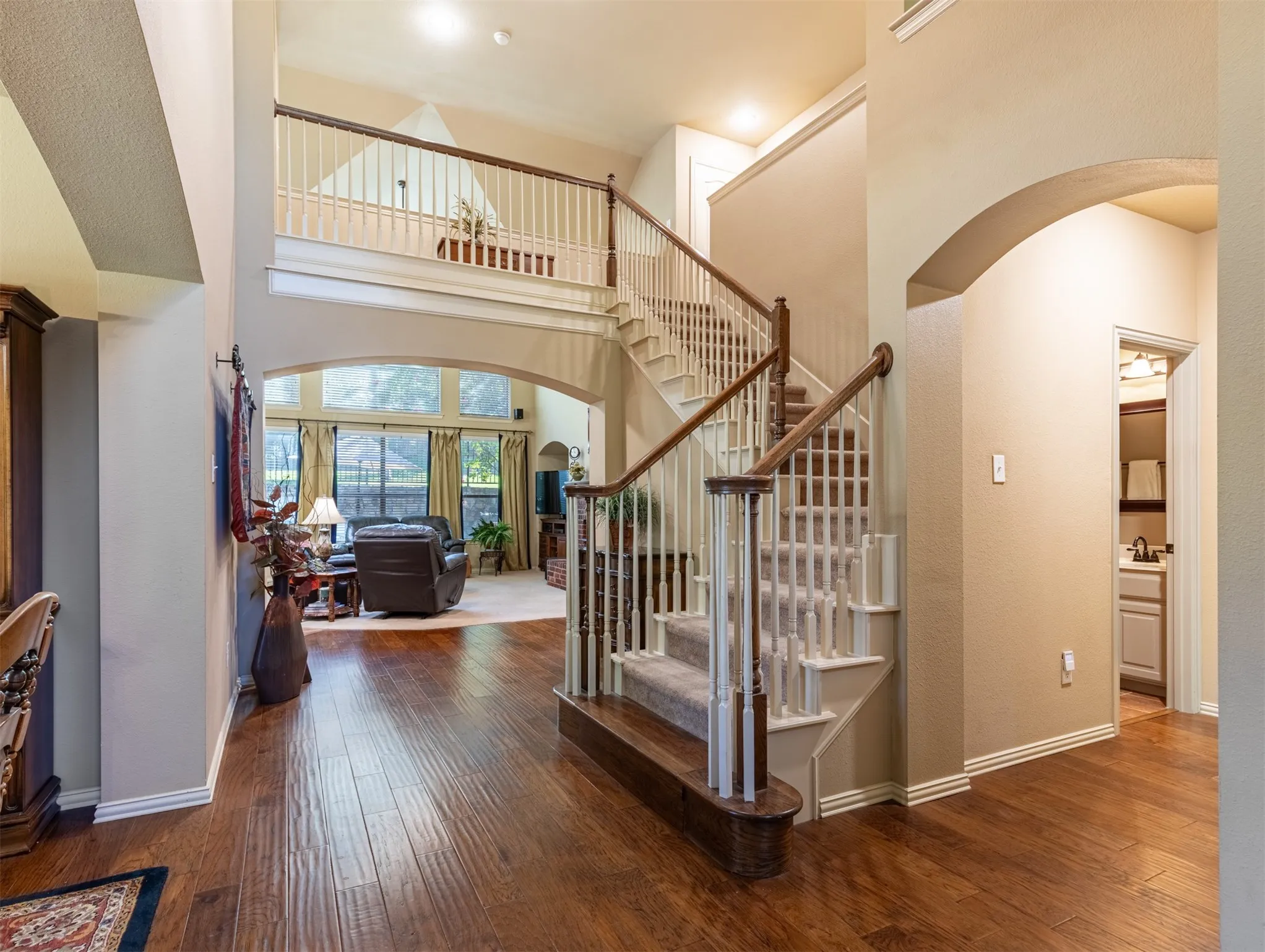 Staircase with balcony view.